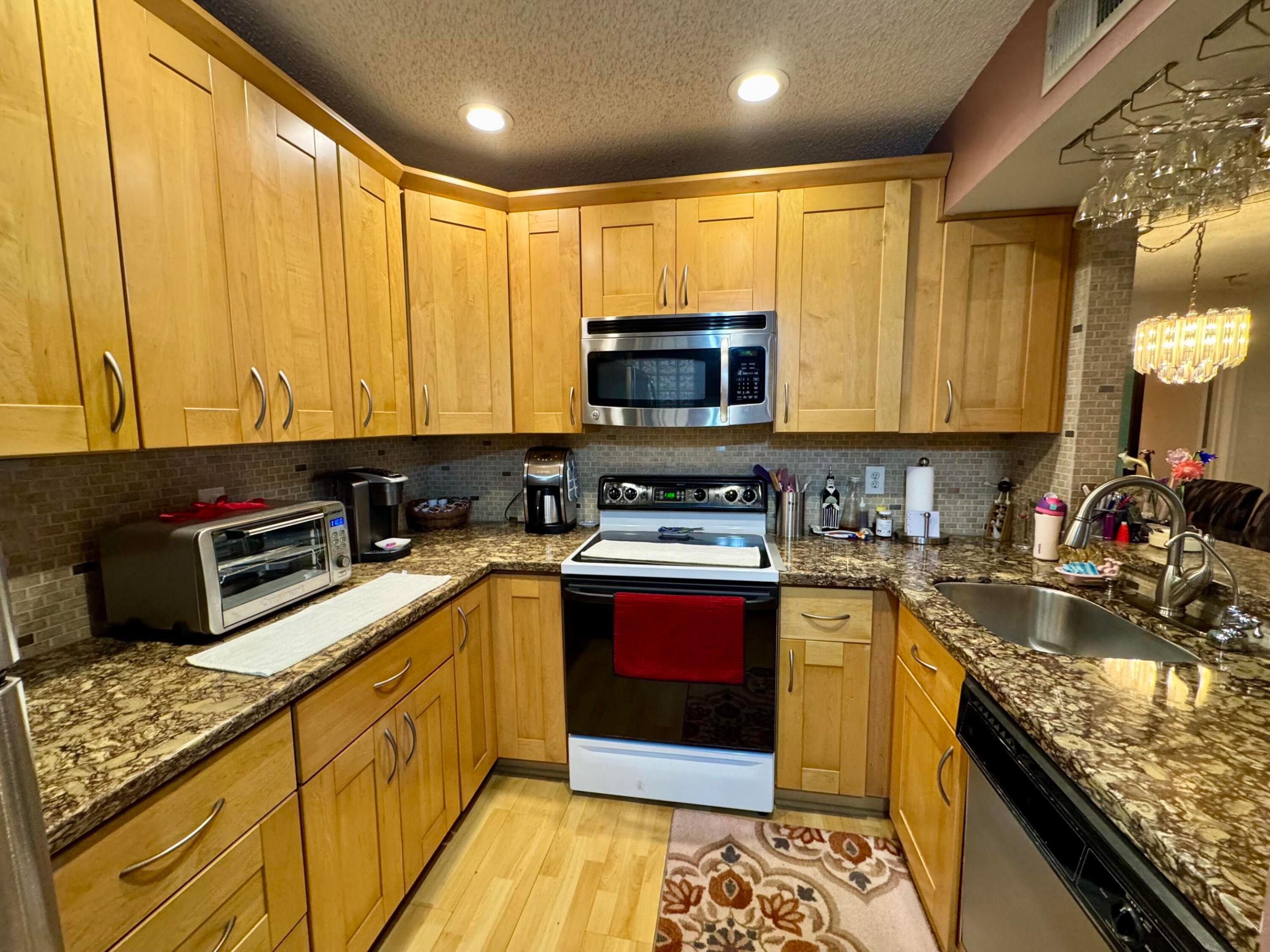 What a great 2 bed 2 bath split floor plan condo first floor unit. Original Owner says time to sell. Remodeled eat in kitchen with lots of cabinets and granite countertops. Extra-large primary bedroom with a huge wall to wall walk in closet and a spacious bathroom as well. The second bedroom is great size, and the closet is more than fitting for anyone as well. Plenty of living space in this charming home. The patio is left open and feels like it is part of the house for more living area. Washer and dryer in the unit, no need to go anyplace to do your laundry. Nice and quiet, relaxing and charming. Don't miss out on this great opportunity to call home.