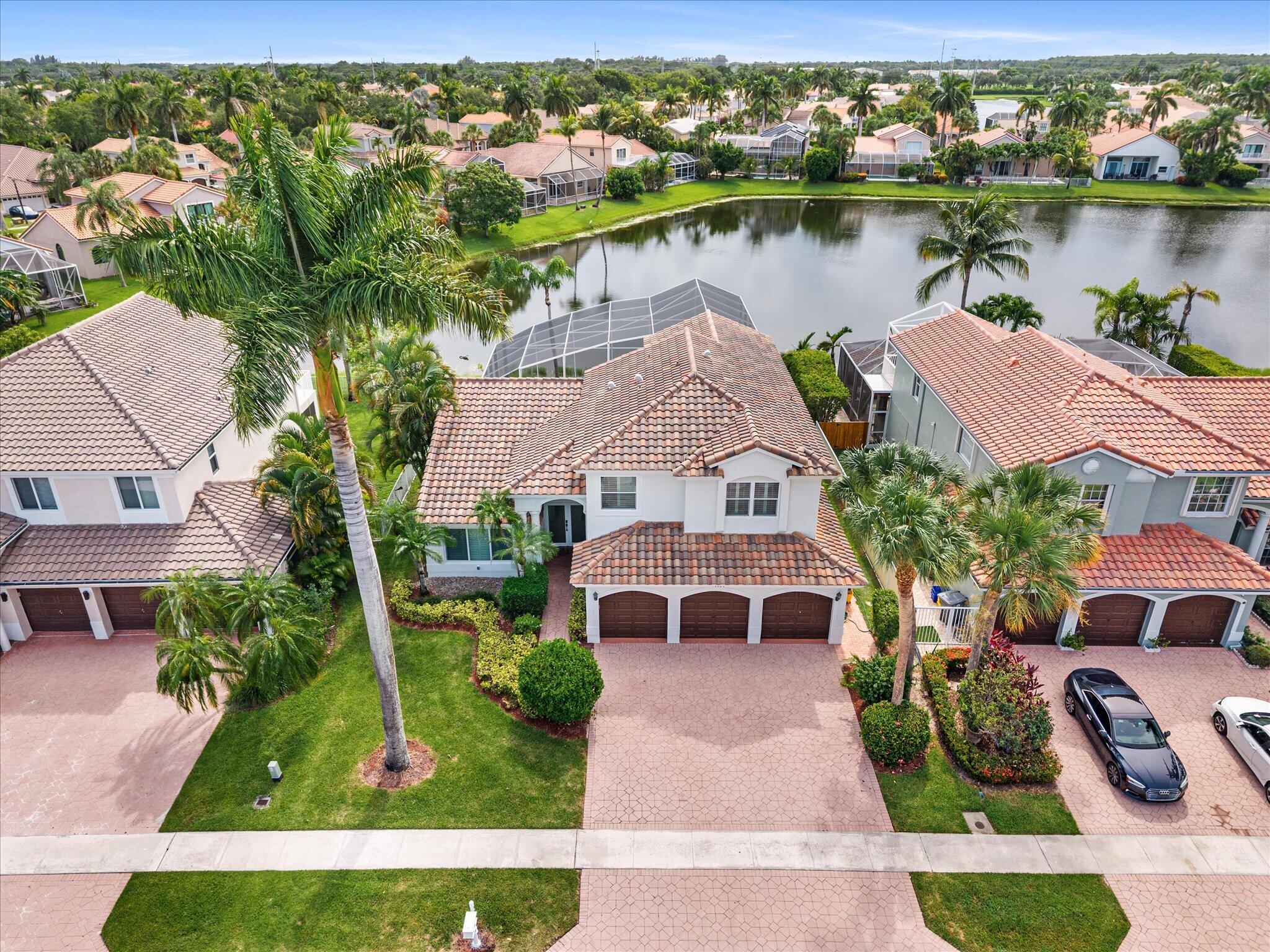Coming Soon in Boca Isles North! Beautifully updated 4-bedroom, 3-bath lakefront home. Screened pool and spa, and stunning western sunset views. Featuring a renovated white shaker kitchen cabinets with quartz countertops, full impact windows and doors, soaring ceilings, plantation shutters, and a flexible floor plan with a first-floor bedroom and full bath plus and added den perfect for a home gym or game-room. All new luxury vinyl modern oak flooring upstairs. The spacious primary suite offers a private balcony overlooking the lake. Recently updated AC in 2022 and the roof redone in 2015. Located in one of West Boca's most sought-after gated communities with resort-style amenities and nearby A-rated schools.