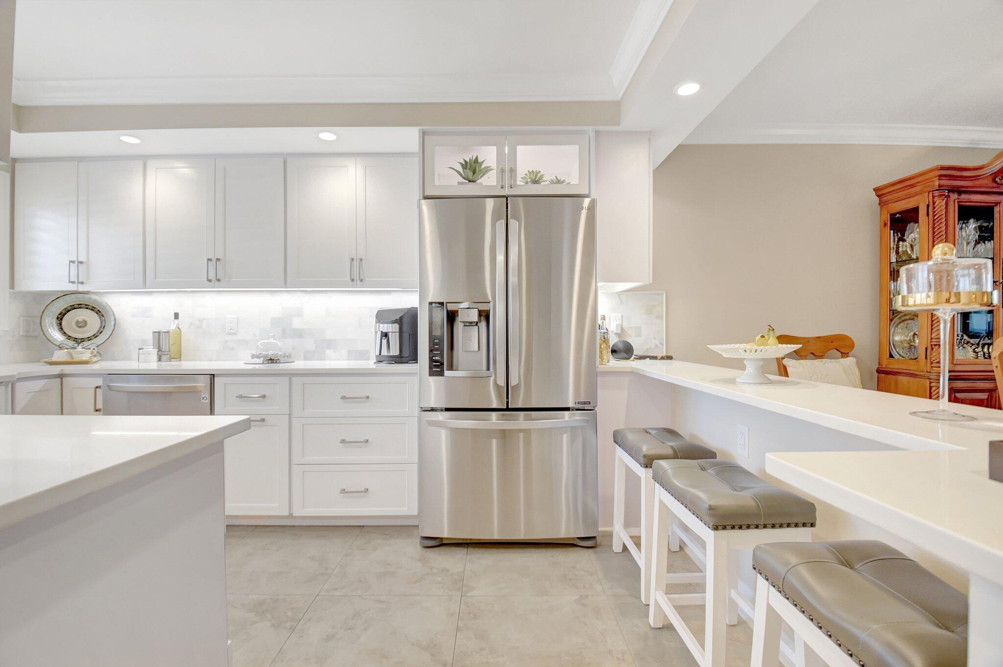 Welcome to this beautifully renovated 2BR/2BA condo in the highly sought-after Seagate of Highland Beach, a premier over-55 community. This home is the epitome of luxury coastal living, featuring stunning design elements like crown molding, 24-inch large profile tiles, plantation shutters and beautiful hardware throughout. The kitchen and bathrooms have been masterfully upgraded with custom cabinetry, quartz countertops, & exquisite tile work, creating a truly high-end feel. The modern kitchen is perfect for cooking and entertaining, while the bathrooms boast seamless shower doors and floor to ceiling tiles for a spa-like experience. Enjoy peace of mind with impact windows and sliders for hurricane protection, along with updated air conditioning and a new water heater (2023). The spacious enclosed patio offers breathtaking views of the Intracoastal Waterway, community gardens and pool, perfect for enjoying the glorious sunsets. For added convenience, the unit also comes deeded with its own covered parking space, ensuring you always have a secure, shaded spot. Seagate of Highland Beach is not just a place to live, but a community offering an incredible array of resort-style amenities. Two stunning pools with panoramic Intracoastal views provide a serene escape, while the waterfront clubhouse features a full kitchen, billiard room, and BBQ grills. Stay active in the fitness center or relax in the beautifully landscaped outdoor areas. For boating enthusiasts, Seagate offers a community "day" dock for boats up to 40 feet, and dockage is available with management approval for overnight stays. Plus, there's ample resident and guest parking for your convenience. The community has recently completed a re-certification, including new roofs, luxurious elevators, resurfaced pools, updated lobbies, and new dockage. With fully funded reserves, Seagate of Highland sets the standard for luxury coastal living. Located just steps from your private deeded beach access, this condo provides the perfect balance of tranquil beachside living and easy access to shopping, dining, and entertainment. This is a one-of-a-kind opportunity to own a piece of paradise schedule your private tour today!