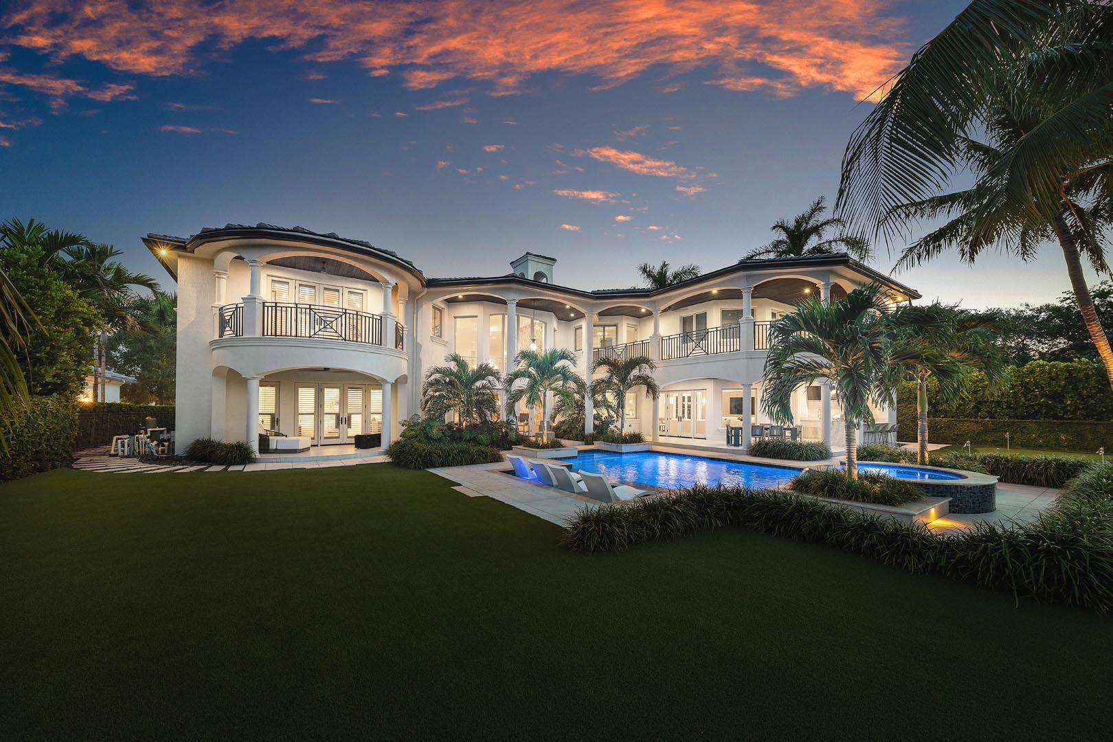 Beyond the gates of a private motor court, this six-bedroom golf course estate offers a lifestyle defined by elegance, privacy, and sweeping views of the Jack Nicklaus Signature Course. From the moment you arrive, the sense of quiet prestige is undeniable. Inside, light pours into the soaring two-story living room, where walls of glass dissolve the boundary between indoors and out. The chef's kitchen, outfitted with professional-grade appliances, becomes the heart of the home—its open layout flowing seamlessly into a sunlit dining space where conversations linger late into the evening by the two-sided fireplace. Step outside to an expansive terrace designed for effortless entertaining, a summer kitchen ready for a sunset dinner party, and a custom heated pool and spa with a sun shelf where loungers drift just above the waterline. Here, mornings begin with coffee in the breeze, and afternoons melt into golden light.  The primary suite is your sanctuary. The suite has a spa-inspired bath, dual boutique-style closets, and a private covered balcony. Every detail speaks to elegance and ease, from whole-home smart technology and natural gas service to an elevator. This is not simply a home; it's a daily experience of comfort, security, and beauty.