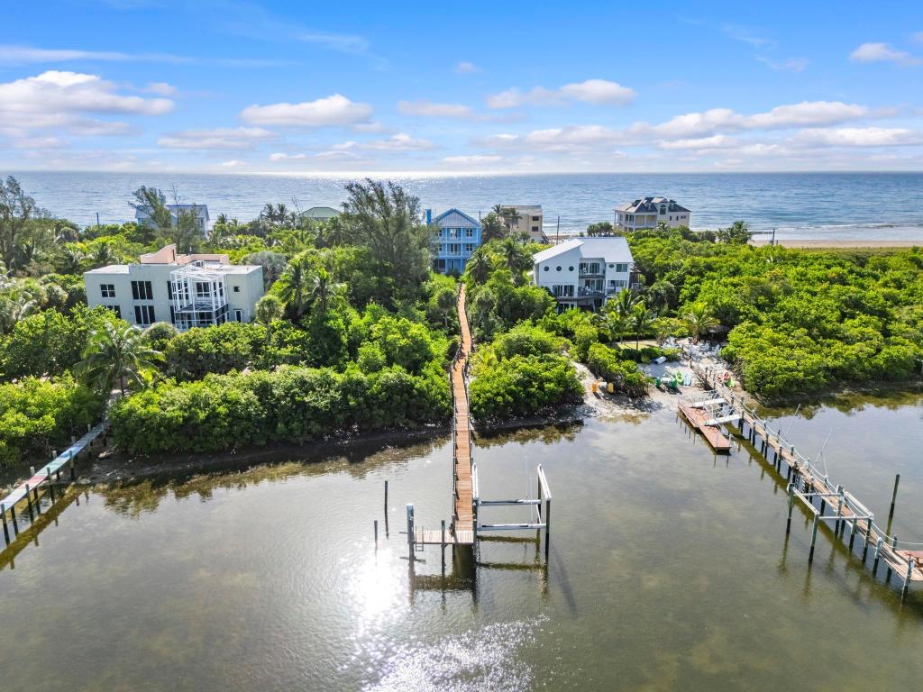 Welcome to the only property currently for sale on Bathtub Beach where you own from the Atlantic Ocean to the Indian River.
Start your mornings with a sunrise over your private beachfront and end your days with sunset views over the river. Whether you're fishing offshore, relaxing at the nearby sandbar, shopping in Palm Beach or flying out of the Stuart Airport this location delivers unmatched access and convenience.
This home boasts 4 bedrooms (possible 5th Bedroom) 3 1/2 bath,den and three car garage. It was built with solid concrete construction, a metal roof and impact glass windows to withstand 200 mph winds. Walk out back to your heated pool with a spa and a 333 ft dock which includes a boat lif