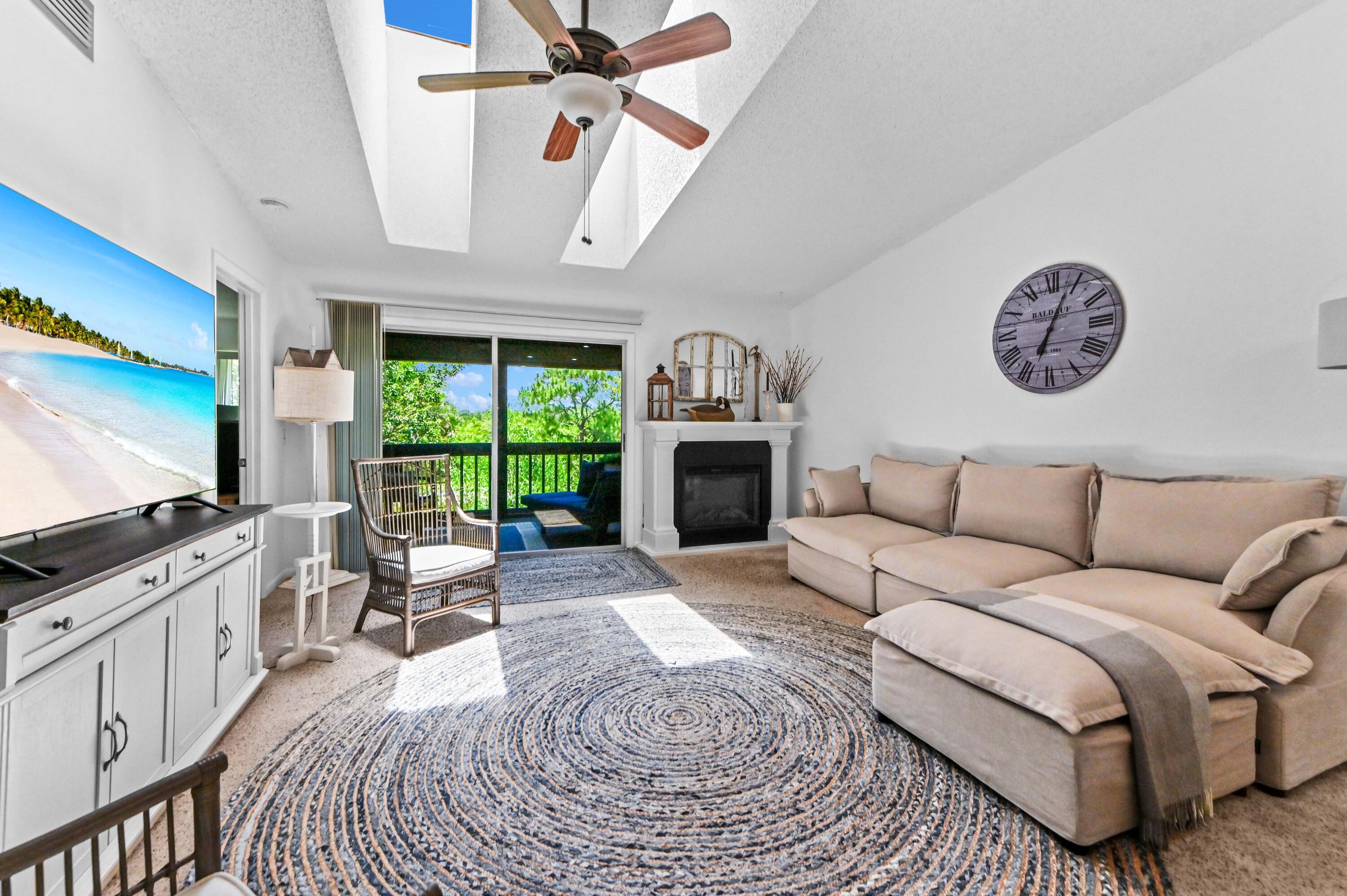 Welcome to this charming coastal cottage-style waterfront condominium in the Pinecroft Condominiums community of Hobe Sound, Florida. This well-maintained second story residence offers 1,177 square feet of thoughtfully designed living space, featuring two bedrooms, each with its own updated en-suite bathroom, and a welcoming foyer that opens into a bright, open-concept layout. The updated kitchen showcases quartz countertops, a stylish shiplap backsplash, hardwood flooring, and a convenient laundry closet with a washer and dryer. Abundant storage throughout the home provides practical functionality without compromising the spacious feel. Enjoy tranquil pond views from the spacious screened in porch, while a wooded path directly across from the condominium leads to the community's heated pool and picnic area. As a waterfront residence, this home also offers the unique appeal of direct water access, enhancing the Florida coastal lifestyle. Located just minutes from Hobe Sound Beach, this property combines comfort, convenience, and a desirable coastal setting. A negotiable fireplace offers added flexibility for the new owner.