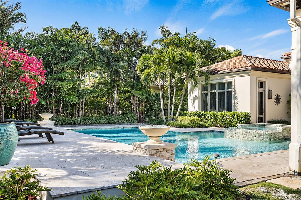 Breathtaking contemporary custom estate impeccably designed and professionally decorated. Endless luxurious details and finishes including top of the line appliances, 70 kw full house generator, Smart House Automation (Savant) and Lutron lighting system. Expansive circular driveway with dedicated parking pad and over sized 3 car garage with sink, cabinetry and air conditioned storage closet. The sprawling 1st floor includes marble and wood floors, custom built ins, walk in pantry, butler pantry, ample storage, his/her master baths large secondary bedrooms with en-suite bath, game room, custom fireplace, cabana bath, gracious summer kitchen and covered patio with phantom screens overlooking grand pool and 8 person spa with raised sun deck. Furnishings negotiable. Complete turnkey home. Seller Motivated. Club approved golf cart included with the purchase.