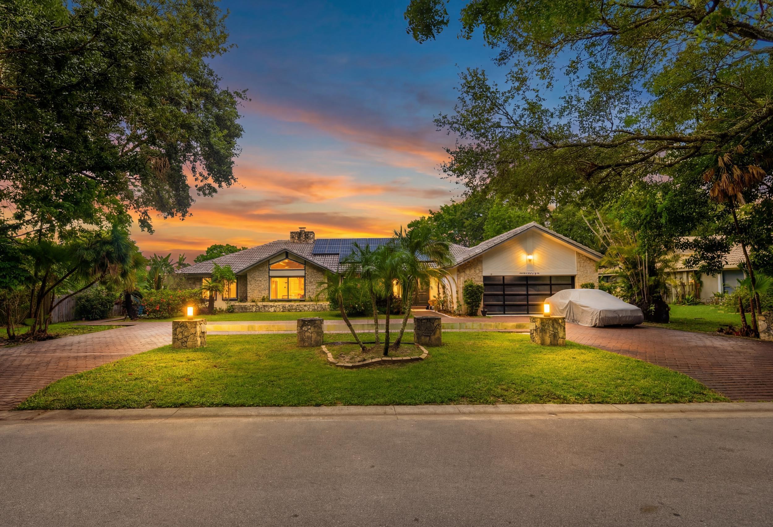 Welcome to one of Coral Springs' most unique properties. Situated on a rarely available double lakefront lot, this private estate offers resort-style living with amenities that are nearly impossible to find in today's market. The centerpiece is believed to be the largest residential swimming pool in Coral Springs, creating a true backyard paradise overlooking the water.  Designed for entertaining and recreation, the property features a private tennis court, expansive outdoor living areas, and breathtaking lake views. The oversized grounds provide exceptional privacy and room to enjoy a lifestyle rarely found in South Florida.  Inside, you'll find spacious living areas, generous bedroom suites, and seamless indoor-outdoor flow ideal for both everyday living and large gatherings. Home offers generous living areas, oversized rooms, and endless potential for customization. Double lot provides opportunities and flexibility not available with typical homes in the area. Conveniently located near top-rated schools, parks, shopping, dining, and major roadways.  Buyer to verify all measurements, square footage, and information deemed important. Proof of funds or lender pre-approval required prior to showing. Shown by appointment only. Please do not walk property without listing agent approval.