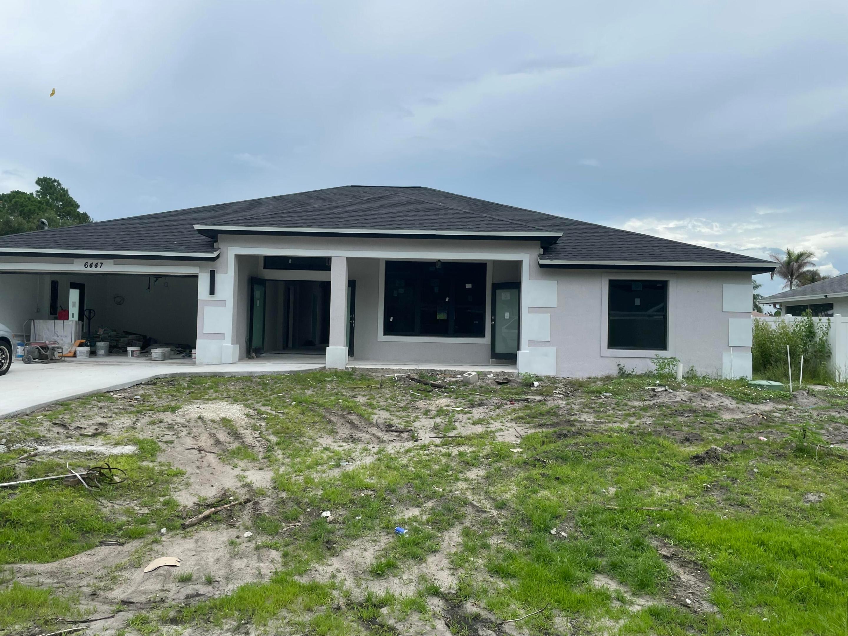 Welcome to your dream home in the heart of one of Port Saint Lucie's fastest-growing and most desirable communities! This brand-new construction residence has been thoughtfully designed with luxury finishes, modern elegance, and everyday functionality in mind.  Boasting 4 bedrooms, 3.5 bathrooms, and 2,183 square feet under air (2,950 total square feet), this stunning home sits on an oversized 10,000-square-foot lot, providing ample space for outdoor living, entertaining, or adding a future pool. From the moment you enter, you'll be impressed by the bright, open-concept floor plan featuring porcelain tile flooring throughout, designer lighting, and abundant natural light streaming through hurricane-impact windows and doors, offering beauty, energy efficiency, and peace of mind.  The gourmet kitchen is a true showpiece, complete with custom quartz countertops, sleek cabinetry, premium stainless steel appliances, and a spacious island that seamlessly connects to the living and dining areas—perfect for entertaining family and friends.  The luxurious primary suite serves as a private retreat, featuring two walk-in closets and a beautifully appointed ensuite bath designed for comfort and relaxation. Additional bedrooms are generously sized, with well-designed bathrooms offering stylish finishes and convenience for family or guests.  Outside, the expansive backyard offers endless possibilities for creating your own private outdoor oasis while enjoying the extra space afforded by the large lot.  Ideally located in highly desirable Port Saint Lucie, this home is just minutes from shopping, dining, medical facilities, and top-rated golf courses. Enjoy nearby attractions including the PGA Village Golf Club, Tradition Town Center, Clover Park (home of the New York Mets Spring Training), Savannas Preserve State Park, beautiful beaches along the Treasure Coast, boating, fishing, hiking, and countless parks and recreational opportunities. With convenient access to I-95 and the Florida Turnpike, commuting throughout the Treasure Coast and South Florida is effortless.  This exceptional new construction home offers the perfect combination of luxury, quality craftsmanship, and an unbeatable location. Don't miss your opportunity to own this stunning, move-in-ready home in one of Florida's most sought-after communities!