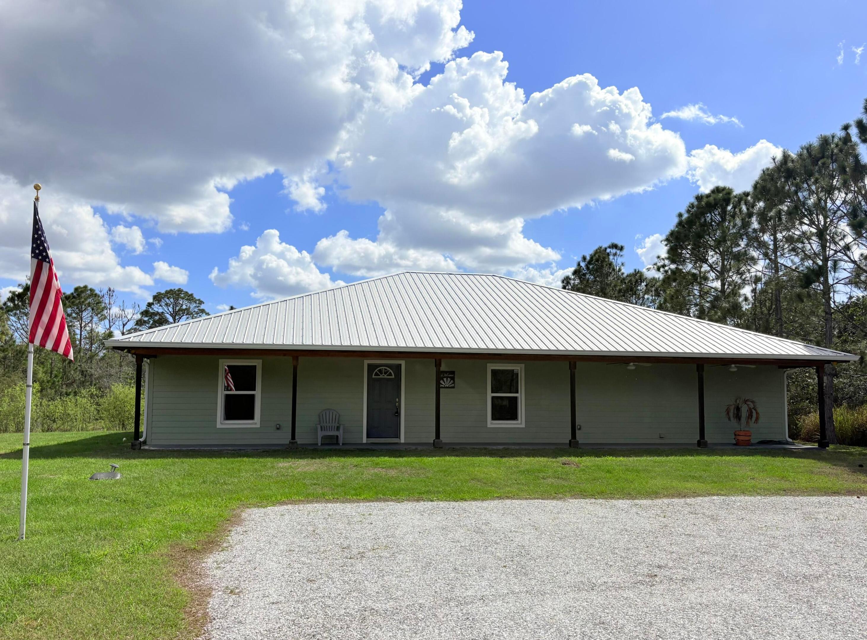 Discover the perfect blend of comfort and outdoor living in Indian Hammock Hunt and Riding Club, a gated community known for its recreational lifestyle. This 3-bedroom, 2-bath home sits on 2.5 acres and offers about 2,100 sq ft, built in 2018 with modern features and country privacy. Inside, enjoy a bright open-concept living and kitchen area, a flex room, dedicated laundry, and spacious bedrooms. Relax on the front and back porches or explore the acreage. Community amenities include a lodge with restaurant, pool, bath house, fitness room, pickleball and tennis courts, skeet and trap, archery, rifle and pistol ranges, private airstrip, horse stables, riding arena, and miles of trails across 2,600+ acres.  -Full house generator with propane backup!