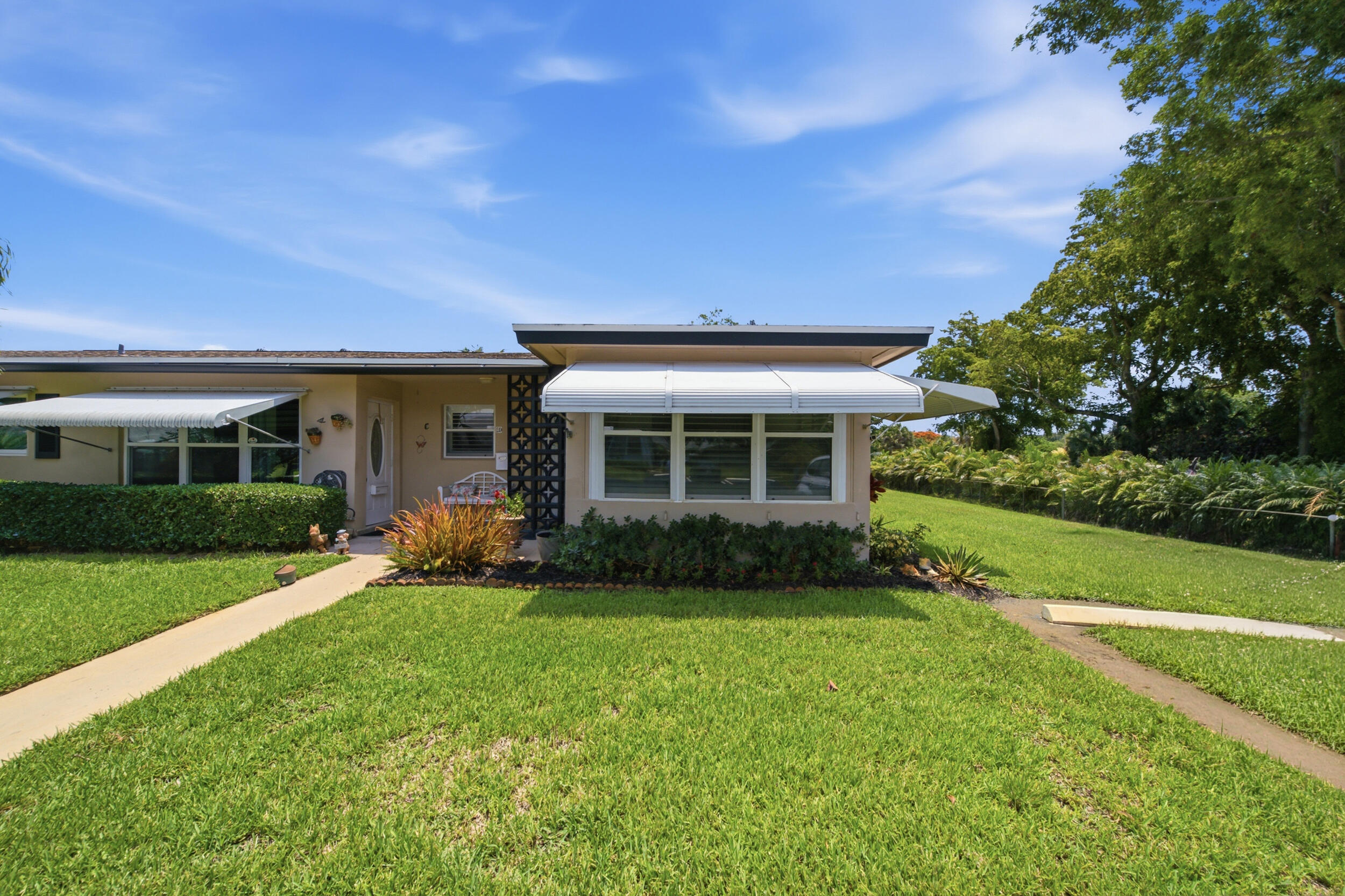 Welcome to 957 Circle Drive — a rare, fully renovated corner villa tucked away on a private oversized garden-view lot in the highly sought-after High Point community of Delray Beach. Located at the end of a freshly paved cul-de-sac, this beautifully maintained residence offers exceptional privacy, lush tropical landscaping, and true turnkey convenience.Designed for both comfort and style, this home features a long list of major upgrades including a new HVAC system, new hot water heater, new roof (2024), and hurricane nail reinforcement completed in 2025 for added peace of mind. All windows and doors are hurricane impact, providing safety, efficiency, and storm protection.The beautifully updated kitchen is equipped with GE appliances, while the spa-inspired bathrooms. See Remarks. The beautifully updated kitchen is equipped with GE appliances, while the spa-inspired bathrooms showcase custom floating vanities, luxurious shower towers, and a whirlpool soaking tub for ultimate relaxation. Custom plantation shutters throughout add timeless elegance and functionality.Being sold fully furnished — including dishes and household essentials — this is a truly move-in-ready opportunity, ideal as a primary residence, seasonal escape, or investment.Step outside to your own private tropical oasis featuring mature coconut palms, a producing key lime tree, pineapple plants, and an expansive yard rarely found in the community — perfect for entertaining, gardening, or simply enjoying the South Florida lifestyle.High Point offers strong financial reserves, no current assessments, and desirable amenities in a well-maintained 55+ community. Conveniently located just 5 minutes from world-famous Atlantic Avenue and only 8 minutes to Delray Beach's award-winning beaches, dining, shopping, and entertainment.This exceptional corner property combines quality upgrades, tropical privacy, and unbeatable location — a standout opportunity in Delray Beach.