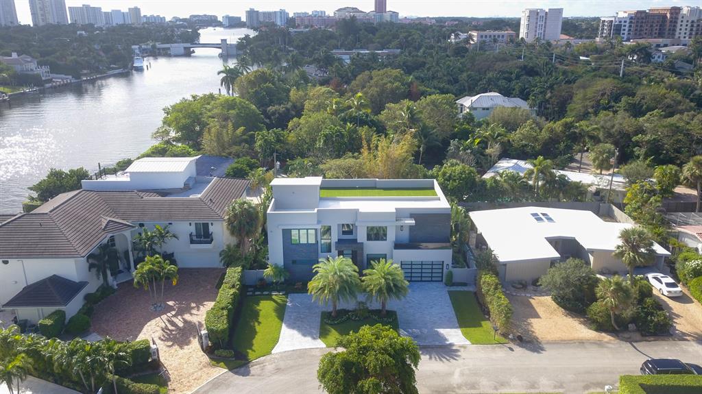 This Dramatic three story contemporary ultra custom residence is one property off Boca Raton's downtown intracoastal waterway.  Walking distance to the ocean and downtown Boca. East of NE 5th Ave on a private cul-de-sac street, the main house features a two story great room, open kitchen & dining room, first floor master suite and full en-suite bedroom. The second level features two ensuite bedrooms (one currently used as an open play area) a full theater, exercise room and office. The third floor opens to the rooftop level with fire pit lounge area, full views of the ICW waterway, the Boca Raton skyline and fabulous sunsets.  Marble circular drive and rear  patio, lap pool, spa and guest house with bright southern exposure and exceptional tropical landscaping. See 'More' 4 added details house features:
Located on Quiet Cul-de sac
Circular driveway
Savant home automation  from iphone with separate settings for each room
4 security cameras 
Honeywell alarms 
Whole house all Concrete pour
Brenner  Architect
12ft entrance door -wrapped in porcelain tile
Custom Millwork
Imported light fixtures throughout the home
Contemporary
Led lighting throughout
Whole home wallpaper 
5 total AC Carrier 
Lush Landscaping  exotic trees and plants
Ficus hedges for privacy 

Foyer:
4 x 2 porcelain squares 
Bartel German engineered doors
Glass railings 

Master bedroom :
Dark grey hardwood floors
Mahogany built in furniture
Somfy shades- Controlled through phone 
His and hers vanity
Zucara bianca marble 2 x 4 
Slab into the shower
Toto toilet and bidet with heat sensors
Quartz countertops
Mexican beach pebble 
Frameless shower
Different showerheads and features
Delano customized walk in closets
Hidden closet within the closet underneath staircase
Floating island in closet
View for master opens to SE views 
Southern exposure
Pgt low e grade windows  energy efficient windows
10 ft high doors

Dining room 
Breakfast area
Subzero mini fridge
Kitchen
Restoration hardware light fixtures. 
With dramatic views
Subzero and wolf appliances
Natural gas
Miele dishwasher
Freezer and refrigerator into cabinets
Porcelain backsplash 
Maytag washer and dryer 
Pantry storage 
Opens to 2 car garages 
Open into the great room 22ft ceilings

Bathroom  half 
Charcoal wall porcelain inlays
4 x 4 porcelain matte finish black 
Toto toilet

Patio Deck
Italian Porcelain
Summer kitchen wolf
420ft guest house/pool house
Contains refrigerator
Outdoor shower enclosed. 
With a porcelain wall  
Cabana bath with urinal
St Augustine grass

Pool
Saltwater pool
8 x 40
Sun shelf
Jacuzzi  8 jets for 6 person
Pebbletec

UPSTAIRS
2nd bedroom
Full bedroom with walk in closet
Wood floors 
Black out shades

3rd bedroom with walk in closet 
Full bathroom 
Glass subway tile
Dark charcoal wallpaper 

Gym
Southern exposure
Exercise equipment negotiable 
Glass framing and door for the gym
Rubber concrete gym floor
Full mirror on one side
Large step out balcony

Media room 
400 sqft theater room
With wet bar full sink
2 rows of seating for 10 people
Subzero fridge
Wine rack
Black granite, glass backsplash
Led starlight ceiling
10ft movie screen 
Server room inside 
Full soundproof room with soundproof door
Hardware for the technology for the home 

Loft/possible bedroom
Walk in closet
Step out balcony 
3rd floor -Rooftop
2000 Sq ft rooftop
Turf
Firepit conveys
View of the intracoastal- SE
Furniture negotiable
STORAGE SPACE 

Room dimensions
Great Room 21 x23
Kitchen 14x16
Laundry 12 x5
Master Bedroom 16 x17
Master bath 18 x 12
Walk In closet 10 x 16
Exercise room 12 x20
Media Room 21 x22
Office 16x14
Bedroom #2 12 x14
Bedroom #3 12 x 14
Bedroom#4/Playroom 14 x 18
Cabana room 17 x 12 
Cabana Bathroom 9 x 12
Subject to errors or omissions.