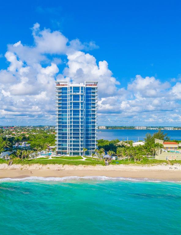 Move in for Season. This Brand New, Never Lived In, direct oceanfront residence has 3-beds, 4.5 baths, 3,753 interior sq. ft. & family room. As one of only 48 residences at the newly completed boutique 5000 North Ocean, a private elevator reveals a flow-through design. An expansive, southeast terrace offers direct views of the ocean and 340' of Singer Island beachfront. West-facing terraces provide dramatic Intracoastal views. Includes two assigned garaged parking spaces & climate-controlled storage locker. 5000 North Ocean provides a gracious lobby with full time reception/concierge services, club room, state-of the art fitness center, south facing oceanfront pool with sun all day, a secluded beach & cabana with fireplaces for entertaining. Pet friendly. Beautifully finished and delivered furniture-ready with designer coordinated selections. Expansive walls of glass, innovative architectural designs and crisp modern interiors combine to create an unprecedented coastal lifestyle. 
Elegant, large format porcelain flooring (24X48) throughout with 8' solid core interior doors. 
The designer kitchen features European cabinetry with the latest storage systems and integrated LED lighting. Pure White Quartz Counter island with waterfall edges & attached table, Quartz countertops and full-height backsplashes. Thermador appliances include a 30' refrigerator and 18" freezer column, gourmet 5-burner GAS-cooktop with 36" retractable Stainless steel canopy hood, under-counter microwave drawer, double wall ovens with warming drawer. The bar area provides both a wine cooler & beverage center. 
Owner's suite includes expansive closet space. The bath finishes incorporate Lux High Gloss White European cabinetry, marble countertop, Grohe fixtures, Kohler sinks, & Toto toilets. Guest baths appointed with same level finishes. 
The laundry room has upper & lower European cabinets with large capacity Electrolux front load washer & dryer.