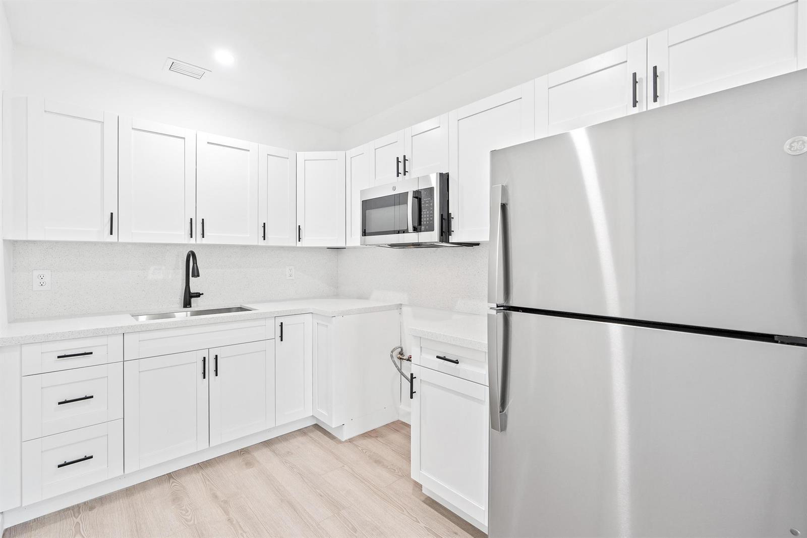 Turnkey and beautifully renovated, this 3-bedroom Lantana home pairs solid 1958 CBS construction with fresh, high-end finishes throughout. Step into a bright, open interior featuring a brand-new kitchen, a stylishly updated bath - completely move-in ready with nothing left to do. Ideally located just minutes from the beach, downtown Lantana, and major commuter routes, with NO HOA and flexible R3 zoning that appeals to owner-occupants and investors alike. Currently vacant for easy showings and a fast, flexible close. A rare renovated opportunity at this price - schedule your private showing today. More photos coming soon!