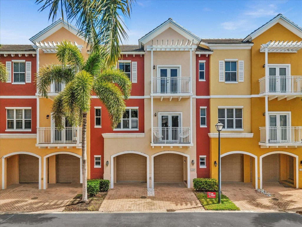 Welcome to 2329 Vintage Drive, a beautiful townhouse located in a sought-after gated community of Lighthouse Point. This spacious 2-bedroom, 2.5-bath home combines modern upgrades with coastal comfort, offering an inviting and low-maintenance lifestyle. Step inside to find brand-new stainless steel appliances in the kitchen, along with a new washer and dryer for added convenience. The custom closet cabinetry in both bedroom closets provides elegant organization and maximizes storage space, while new roller blinds give every room a clean, modern finish. The garage features pristine new epoxy flooring, perfect for parking or additional storage. Nestled in a quiet, well-maintained community, this townhome is just minutes from shopping, dining, parks, and the beautiful beaches of South Florida