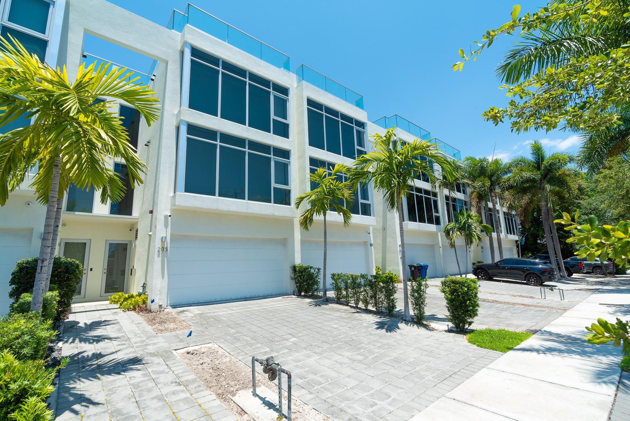 Fisher Auction Company is pleased to present this magnificent, luxury waterfront townhome in “Acqua Marina” on prestigious Hendricks Isle in Ft. Lauderdale, FL. This massive 7,412± square foot 6 bedroom, 5.5 bathroom upscale townhome was built to impress. Originally built in 2020, the townhome features major upgrades including: floor-to-ceiling windows with custom electronic blinds, a Generac Protector whole house generator, a magnificent Chefs Kitchen with exclusive Miele appliances including refrigerator/freezer, conventional oven, stovetop, microwave and convection oven, coffee/cappuccino maker, warming oven and 2 dishwashers, custom counter tops, custom remote controlled lighting throughout, complemented by 9’ ceilings, solid wood 8’ high doors with high end hardware and so much more! This one-of-a-kind townhome boasts a 700+ square foot 4 vehicle garage, perfect for your street toys or car collection and 2 - 18’ x 45’ boat slips for a Mini Yacht, Sport Fisherman, Center Console or sailboat. Located in the heart of Las Olas, enjoy the award-winning restaurants, nightlife, and Fort Lauderdale's white sand beaches. You can enjoy the beautiful sunrises and sunsets from the 16’ x 28’ in-ground heated pool with Jandy Tru Clear Filtration System or from the huge 3,000± square foot rooftop terrace.