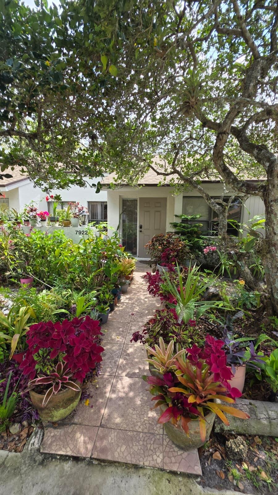 LOCATION, LOCATION:   Welcome to your peaceful escape in the heart of Plantation. Close to Shopping, Restaurants, Highways, University and the popular 'PLANTATION WALK'.   Immaculate well kept 2/2 villa in an established, quiet community of Alpine Woods of Jacaranda. Desirable one story, with bright and open concept living space, vaulted ceilings throughout,  spacious kitchen and two master bedrooms. Laminate floors throughout most of common living and 1 bedroom. Private screened outdoor area, overlooking the water, perfect for mediation, yoga or quiet mornings.  These villas rarely come available so get it while you can.