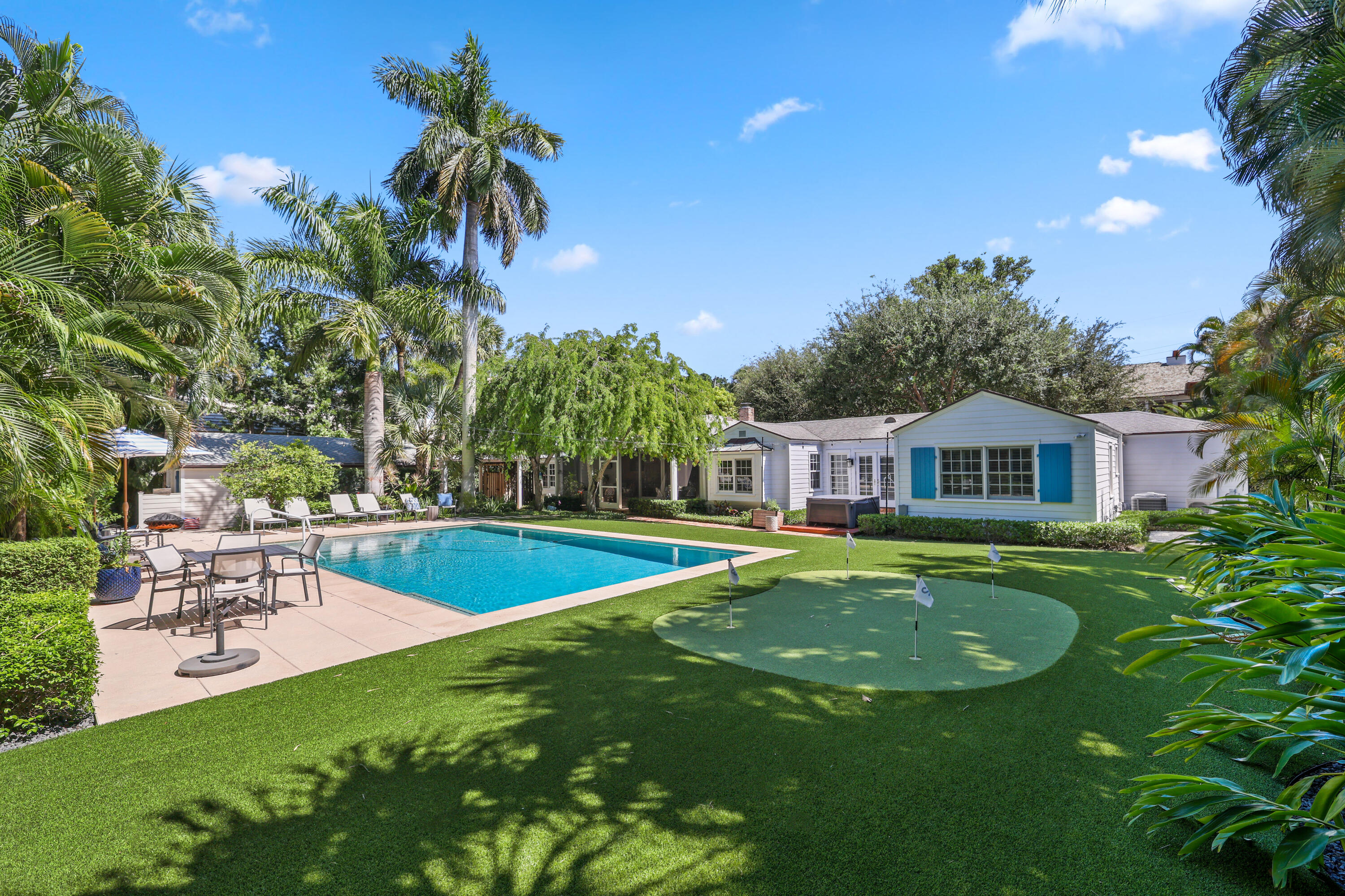 The Epitome of Luxury & Charm. Nestled in the famed Palm Trail Neighborhood just a few short blocks to Atlantic Avenue lies the Kismet Cottage. The word Kismet meaning ''fate'' or ''destiny''.  This enchanting residence offers a harmonious blend of vintage charm with modern amenities. Built in 1946, this home beautifully captures Delray's timeless coastal elegance. With its classic details, high ceilings, and meticulously crafted millwork it seamlessly blends tradition with contemporary comforts. The formal living room greets you with a real wood burning fire place.  The welcoming family room, adorned with a unique brick floor inlay and soaring ceilings opens into a gourmet kitchen, outfitted with top-of-the-line appliances: a Sub-Zero refrigerator, Wolf 6-burner stove, dual Wolf ovens, and twin Cove (Sub-Zero) dishwashers. Kitchen also includes a full bar with wine storage, a fully outfitted butlers pantry and large walk in pantry. The homes' clever floor plan offers split bedrooms and privacy for guests. 
Oversized sliding glass doors lead to the newly built screened garden room and then to the meticulously landscaped grounds. Complete with mature foliage offering privacy and quiet, turf grounds complete with putting green.  The star of the backyard is the oversized heated pool boasting a generous sun shelf, offering the perfect backdrop for sun-soaked afternoons.

Complementing the main house is a one-bedroom Casita with its own fully equipped kitchen and a modern bath, making it a haven for visitors.

This charming residence features an integrated Sonos sound system, ADT security system, and whole house Generac generator further emphasizes the attention to modern comforts. Added luxuries include hurricane-impact windows and an air-conditioned garage. The home has a full house Kagan water filtration system. Backyard features organic SWAT mosquito system

Just steps away from the tranquil Intracoastal and just a bike ride or stroll away from the pristine beach and vibrant shops and restaurants of downtown Delray.  This home is in the perfect location to enjoy the golf cart lifestyle! 

Offering 3033 square feet of artfully designed space, the residence includes 3 bedrooms and a den in the main house with 3 full baths. The casita has an additional bedroom with a 4th full bath.  The property stands tall on an oversized lot, ensuring exclusivity and arguably one of the nicest backyards in town

Kismet Cottage is more than a home; it is a harmonious blend of luxury and history. Within its walls, every day offers the promise of cherished memories. This is your chance to experience a life framed in elegance and comfort.