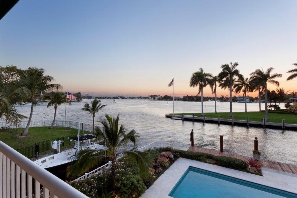 Wondrous wide-reaching water vistas expand over the Intracoastal Waterway and New River all the way to Rio Vista and Harbor Beach from this Modern Mediterranean estate, one property from the point, on 100± ft. of waterfront with yacht dockage. The dramatic 2-story living room with fireplace opens into a window-lined turret-style solarium, leading to the sensational resort-style pool patio with canvas-covered wet bar. The luxurious full-floor master suite opens to a spectacular view balcony.
