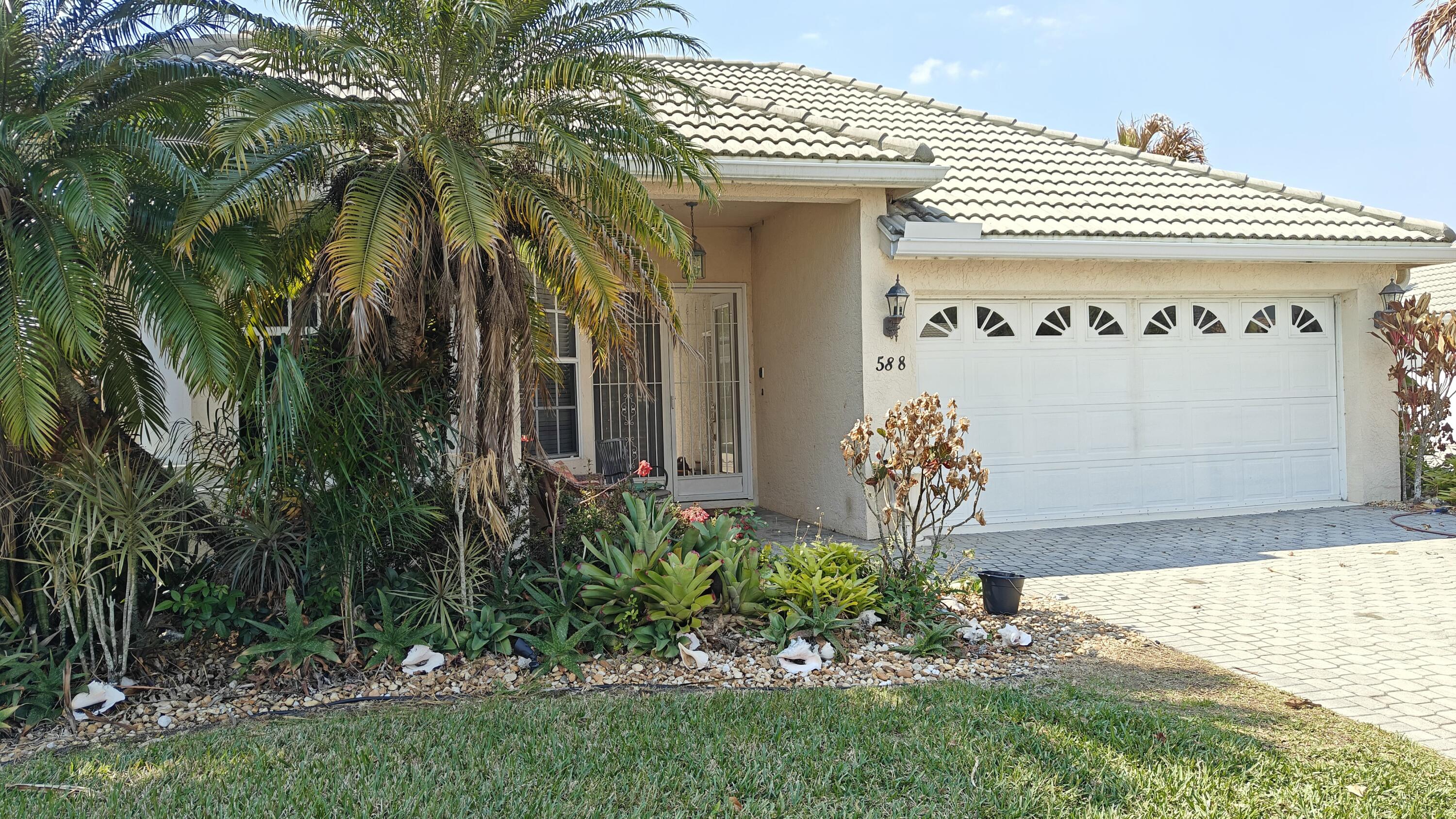 Welcome to this stunning 3-bedroom, 3-bathroom, 2-car garage St. Andrews model tucked away on a peaceful cul-de-sac in the highly sought-after Lake Charles community of St. Lucie West. Enjoy tranquil lake views, exceptional privacy, and approximately 100 acres of scenic waterways behind the home perfect for fishing, kayaking, and enjoying Florida's natural beauty. Thoughtfully designed in a courtyard style, this residence perfectly blends comfort with resort-style living.  This popular floor plan showcases the coveted courtyard concept, centered around a sparkling in-ground pool and spa; your own private oasis ideal for entertaining or relaxing. A charming tiki bar enhances the outdoor retreat, creating the ultimate Florida lifestyle setting. The detached guest suite features its own full bath, offering exceptional privacy for visitors, extended family, or the perfect home office.  Inside, the spacious family room is highlighted by a cozy gas fireplace, creating a warm and inviting focal point for gatherings. Beautiful tile flooring flows throughout the home, providing a clean, cohesive look along with easy maintenance.  Residents of Lake Charles enjoy a manned, guard-gated entry and exclusive access to the beautiful Club clubhouse, featuring a magnificent heated pool and spa, library, media center, lighted tennis and pickleball courts, basketball court, shuffleboard, bocce, horseshoes, playground, and picnic areas with BBQ grills. Scenic preserves, jogging and biking paths, and interconnected lakes for non-gas-powered boats provide endless opportunities for outdoor recreation.  Association fees include landscape maintenance, basic cable, and internet, offering both convenience and value.  Ideally located in the heart of St. Lucie West, this home is just minutes from premier shopping, dining, entertainment, and medical facilities. Enjoy easy access to I-95 and Florida's Turnpike for convenient commuting and travel. Sports enthusiasts will love being close to Clover Park, the spring training home of the New York Mets, as well as championship golf courses, parks, and year-round community events. From waterfront recreation to vibrant restaurants and retail destinations, St. Lucie West offers the perfect blend of relaxation, convenience, and active Florida living.  Experience secure, amenity-rich living with breathtaking lake and waterway views in one of St. Lucie West's most desirable communities.