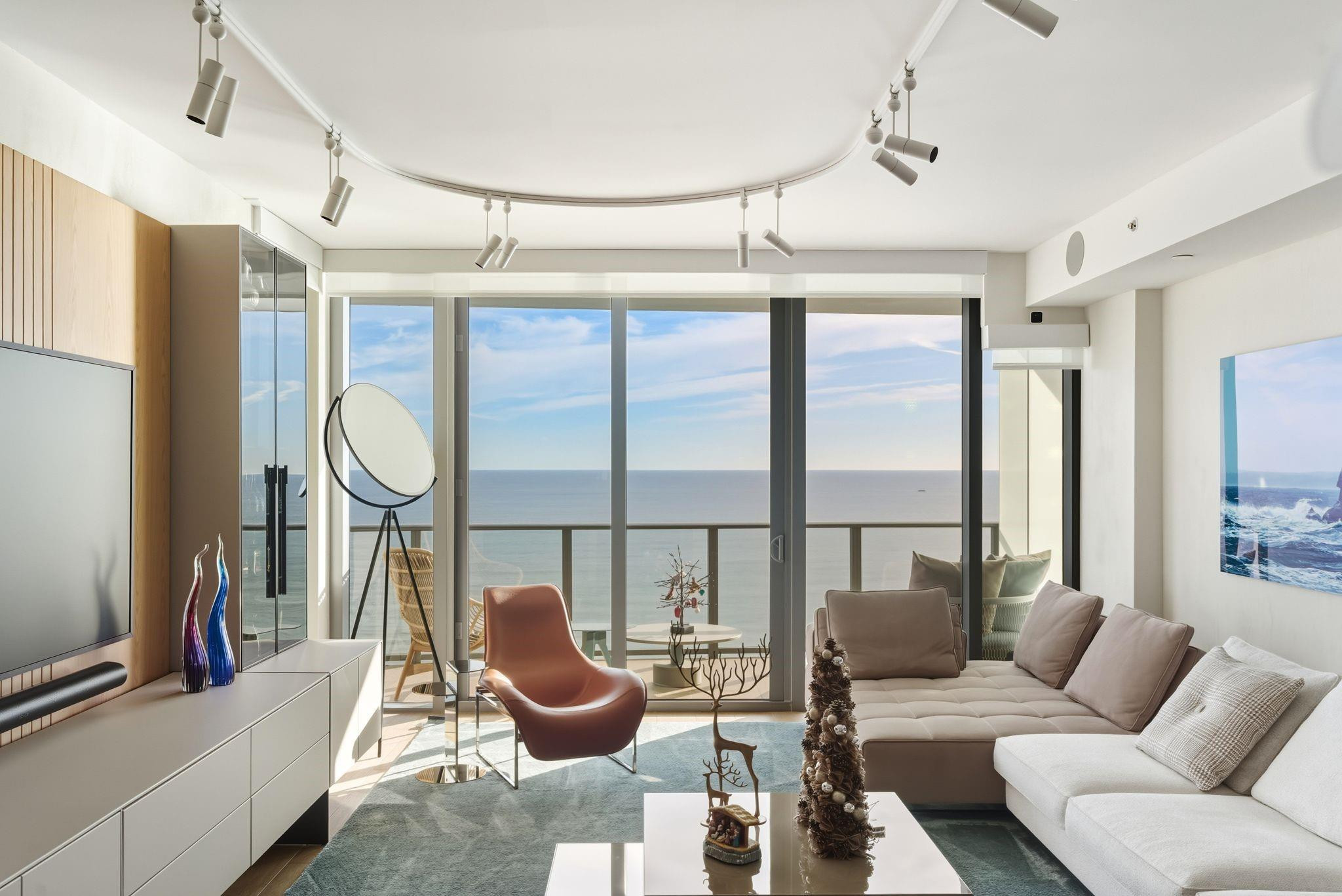 Designer-curated North East Corner residence! This sought-after floor plan features 3 beds, 3.5 baths plus den, designed by Aitken Studio featuring: custom lighting by FLOS, bespoke millwork, custom closets and window treatments throughout.  Floor-to-ceiling glass open to expansive sunrise and sunset balconies. Italian kitchen cabinets with porcelain countertops, Wolf & Sub-Zero appliances, gas range, wine fridge, and espresso machine. Smart home automation, integrated audio, and private wine storage. Resort-style amenities include private beach with service, 2 pools, hot tub, fitness center, concierge, and 24/7 valet, minutes to dining, boat clubs, and Hillsboro Inlet.