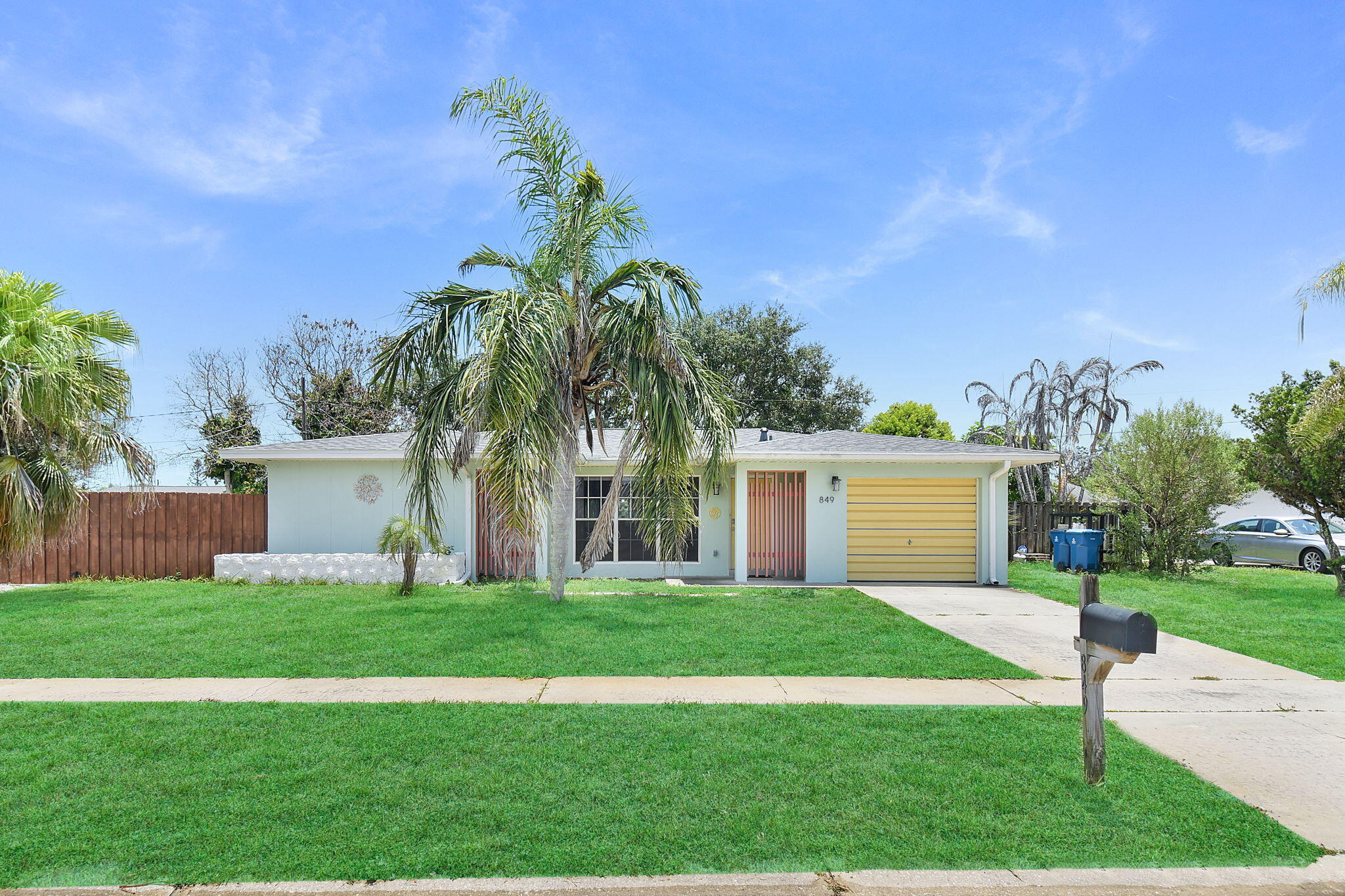 Mid-century modern charm abounds in this CBS home that features open living, two nicely-sized bedrooms and two baths. Kitchen and baths both updated with kitchen including granite tile countertops, stylish backsplash, stainless appliances, and wood cabinets. Cheerful colors throughout. Relax on the covered, screened lanai and enjoy a fully private backyard. Bring your toys (boat/RV) as there is ample parking  both in front of fully fenced backyard and behind the fence. Shed tucked away in corner of yard offers additional storage. Newer roof (2023) for peace of mind. Great location with proximity to Turkey Creek Sanctuary and to Goode Park boat ramp.