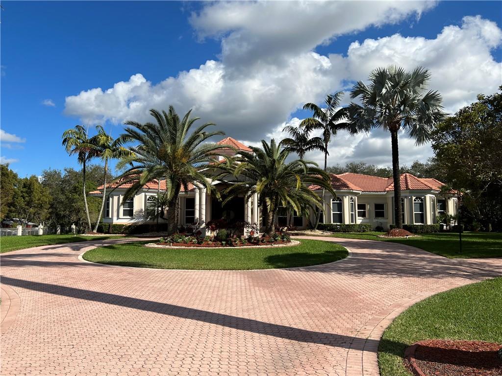 ** A MEDITERRANEAN MASTERPIECE, THIS CUSTOM ESTATE IS SCREAMING WITH STYLE. AMAZING ARCHITECTURE 4 BED 4.5 BATH HOME . PLUS OFFICE/DEN, BILLIARD ROOM, GYM AND HOME THEATRE. TOP OF THE LINE DESIGNER ELEMENTS THROUGHOUT. LUSH LANDSCAPING, POOL, PRIVATE GATES, WITH FENCING ALL ROUND. ALL THIS AND MORE LOCATED IN THE PRESTIGIOUS SUNSHINE RANCHES. **