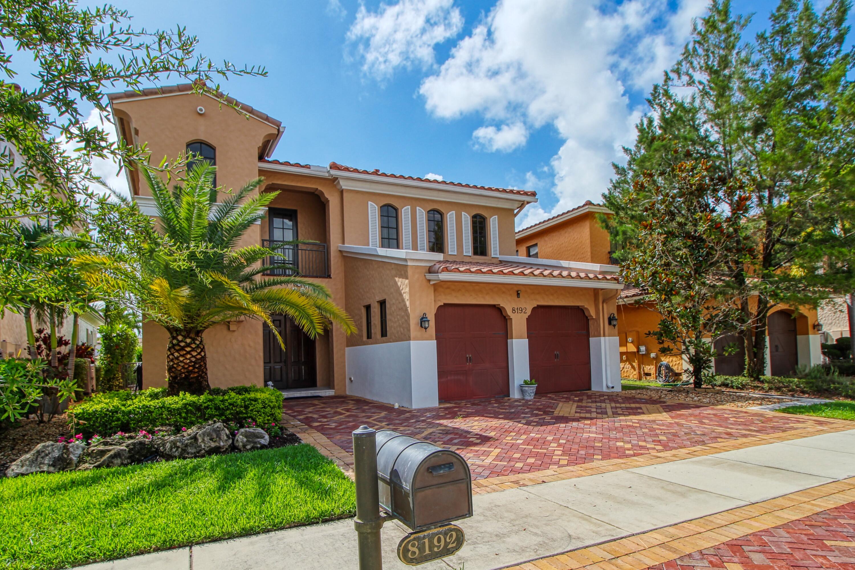 Experience luxury living in Parkland Golf & Country Club at this stunning waterfront home! This 5 bd, 4 bth residence offers elegance & comfort with crown molding, vaulted ceilings, recessed lighting, impact windows & marble & hardwood flooring throughout. Plus a central vacuum. The chef's kitchen features granite countertops, a large island, & stacked ovens. The great room boasts arched doorways, wall-to-wall glass doors, & serene water views. The master suite has a private balcony, an en-suite with walk-in closets, & double vanities with marble accents. Upstairs, two bedrooms share a Jack & Jill bath & one with an en-suite full bath. The main floor bedroom is ideal for an office/guest suite. Outside you'll find a private pool with breathtaking lake views. Don't miss out—schedule today