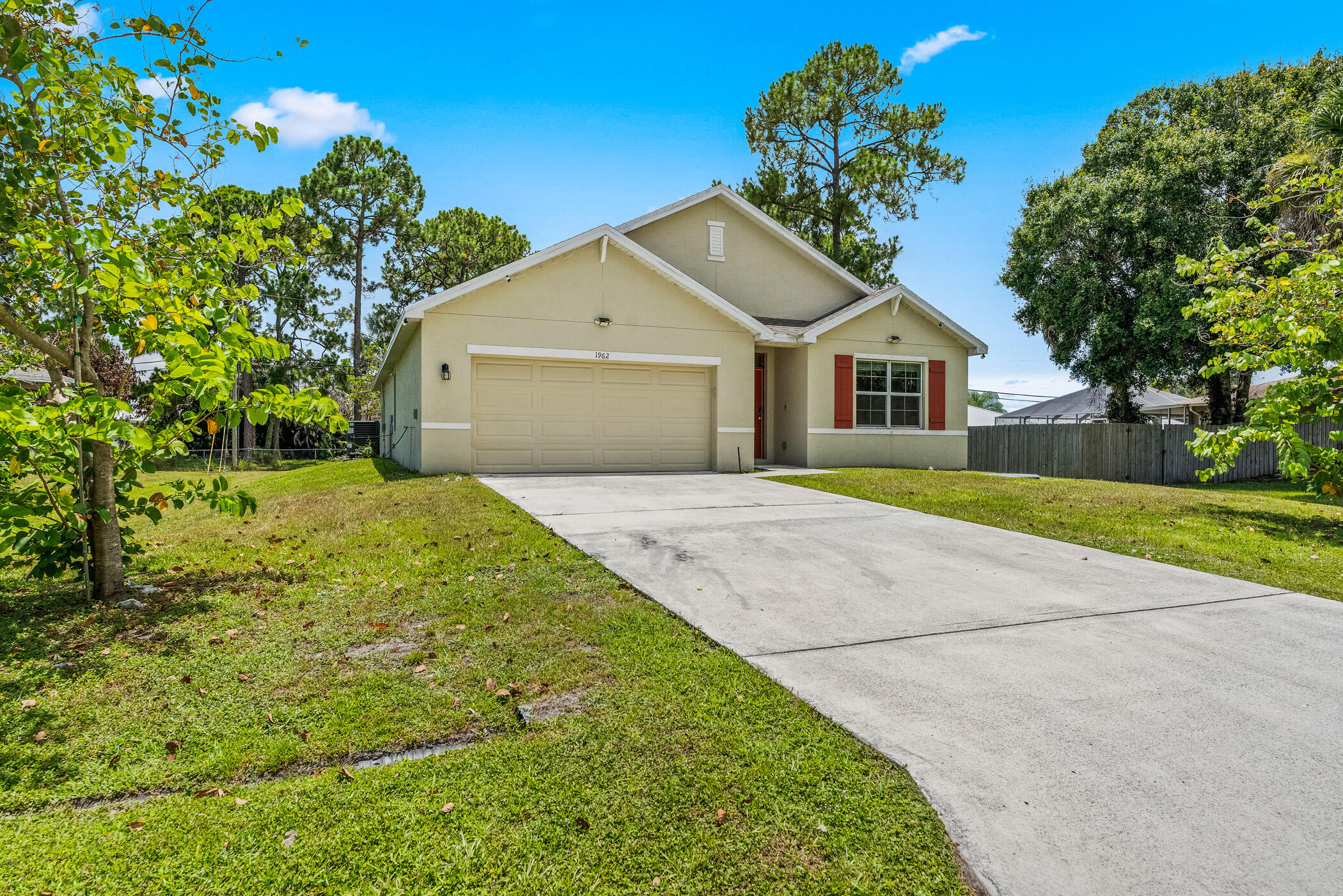 Welcome to this charming single-story residence in Port St. Lucie Section 11, offering 1,916 square feet of comfortable living space. This four-bedroom, two-bathroom home provides ample room for various needs, whether for guest accommodations, home offices, or personal retreats. The practical one-story layout eliminates stairs and simplifies daily living, while the attached two-car garage offers convenient storage and vehicle protection. Located in the established Port St. Lucie Section 11 community, this property presents a solid foundation for those seeking a straightforward, well-proportioned residence in a developed area.