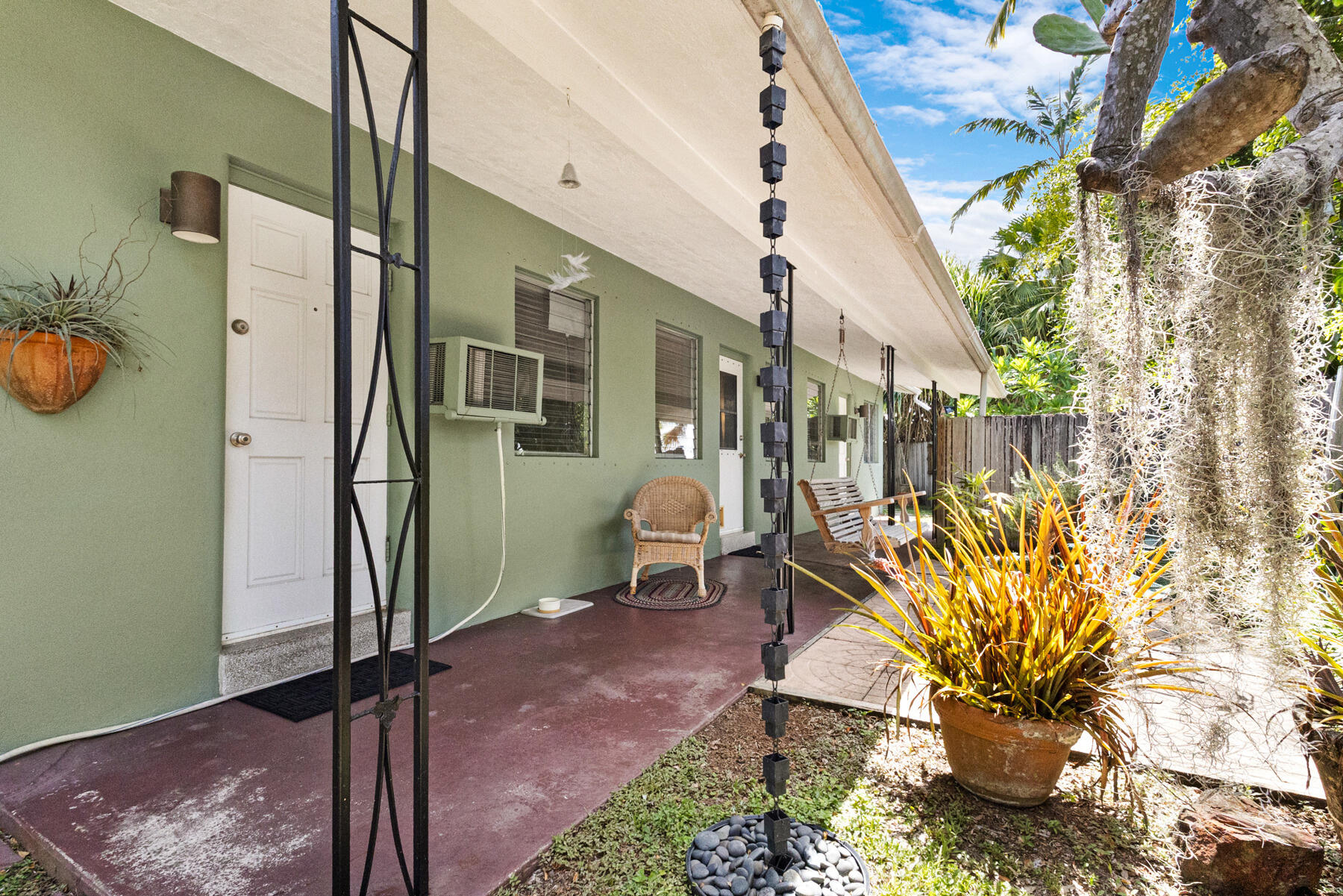 Impeccably maintained legal duplex currently occupied as a single family home. 2 electric meters. 2 addresses. 2 hot water heaters. Can operate as a 1/1 + 2/2 with 2 Kitchens. 3 full bathrooms. 50x135 corner lot with tons of mature exotic foliage. Fountain with aquatic plants. 2 large storage sheds. 3 paved parking spaces. Complete decorative perimeter wood privacy fence with 3 gates. This home is spotlessly clean. You can be up and running quickly with your new tenants at full market rent. (washer/dryer excluded)