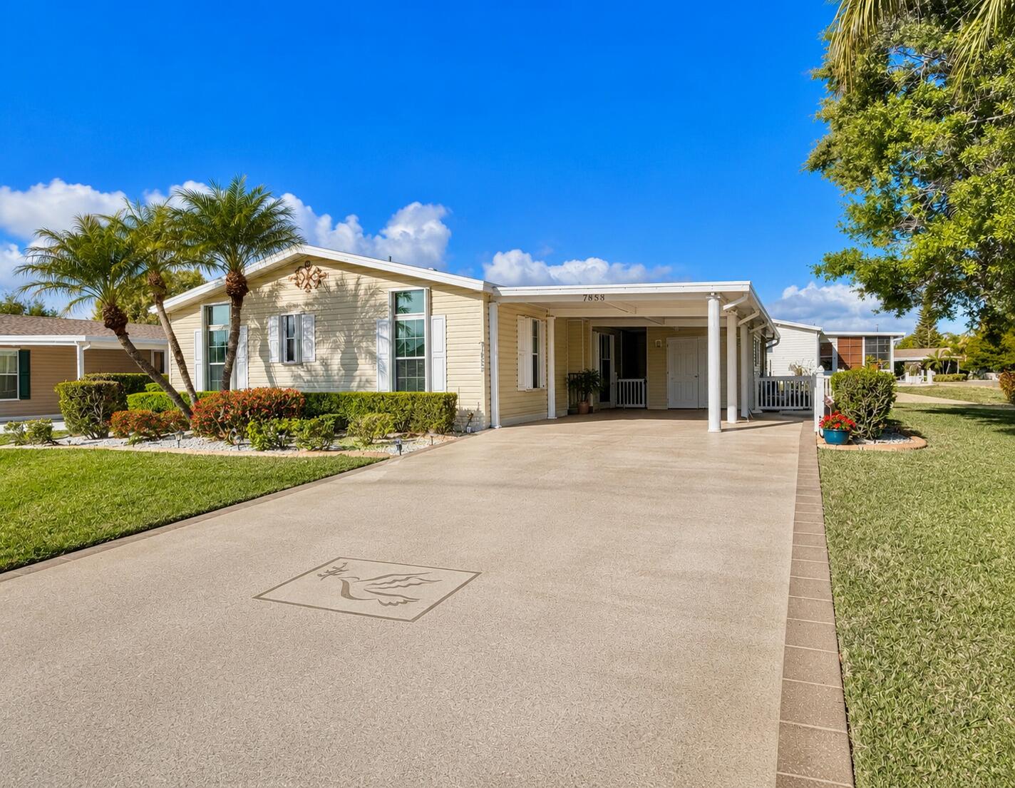 Do not miss out on an opportunity to own this rare home layout in Savanna Club the most sought after 55 and older community in Port St. Lucie with community amenities, including numerous clubs like Mahjong, women's clubs, men's clubs, Pickleball, two Pools, a gym, on-site restaurant and more! This prestige home offers a new roof, new moisture barrier, and low land lease on corner lot. This home features two bedrooms, the master bedroom has two closets, one of which is a walk-in, plus a bonus room that can be used as a guest space, an office, or  a playroom which opens to a large airy living room, a dining area, beautiful bright kitchen with no shortage of cabinets or counterspace perfect for entertaining. Home is vacant, photos have been enhanced and virtually staged.  Land lease property. Home is vacant, photos feature AI enhancement and virtual staging.