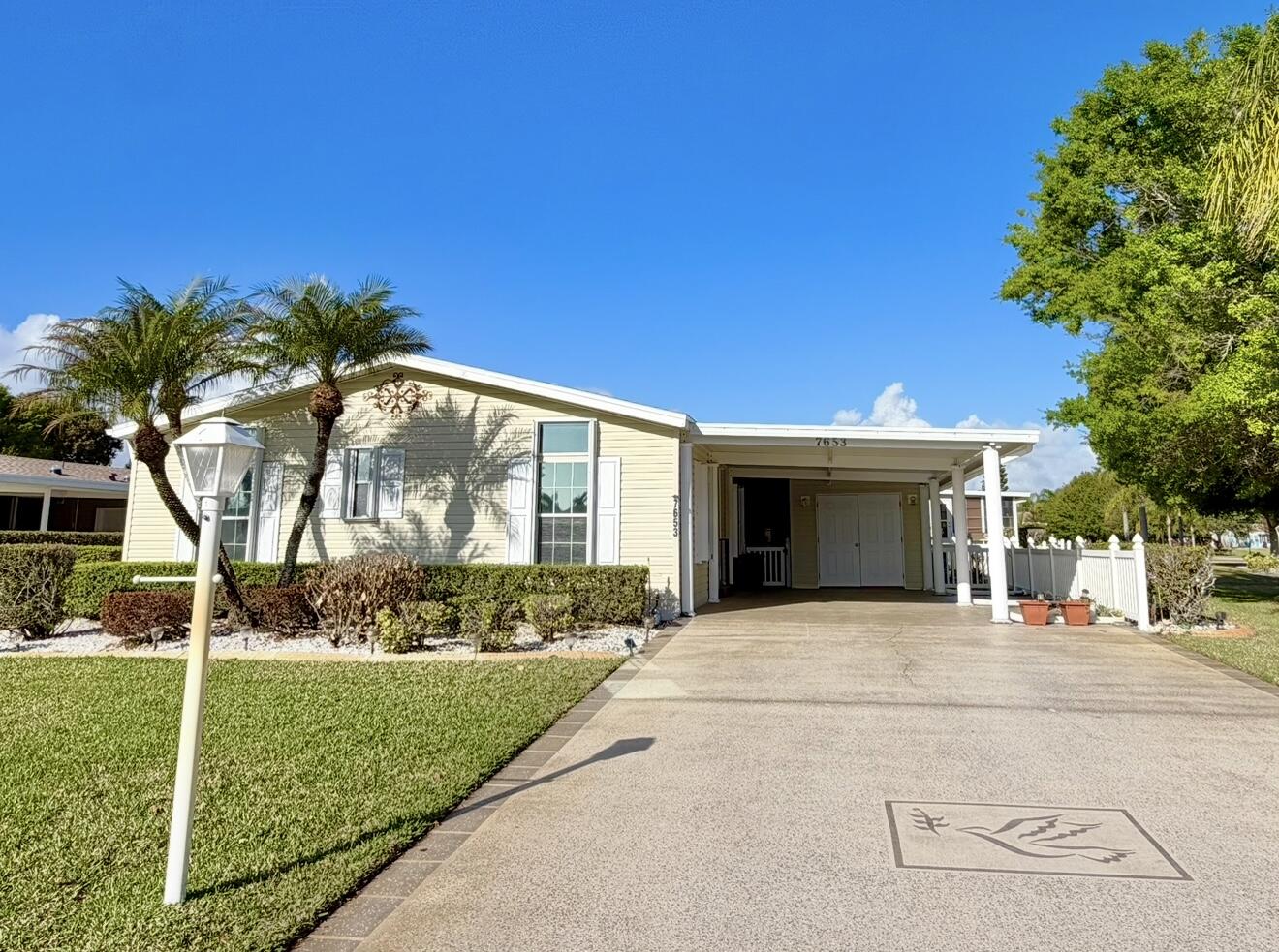 Do not miss out on an opportunity to own this rare home layout in Savanna Club the most sought after 55 and older community in Port St. Lucie with community amenities, including numerous clubs like Mahjong, women's clubs, men's clubs, Pickleball, two Pools, a gym, on-site restaurant and more! This prestige home offers a new roof, new moisture barrier, and low land lease on corner lot. This home features two bedrooms, the master bedroom has two closets, one of which is a walk-in, plus a bonus room that can be used as a guest space, an office, or  a playroom which opens to a large airy living room, a dining area, beautiful bright kitchen with no shortage of cabinets or counterspace perfect for entertaining. Home is vacant, photos have been enhanced and virtually staged.  Land lease property. Home is vacant, photos feature AI enhancement and virtual staging.