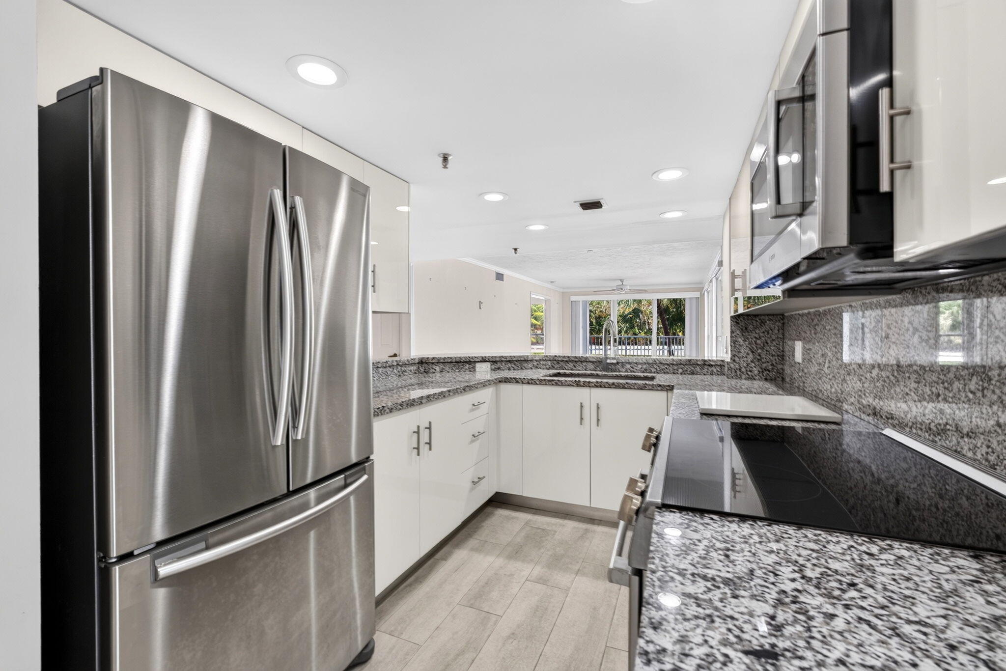 Opportunity to affordably lease this 2 bedroom/2 bathroom with in unit washer/dryer- unfurnished condo with North East views in a prime West Palm Beach location. Pet friendly building, with covered parking. Just bring a paint brush, this unit has several updates, including kitchen, primary shower, and floors.  Ideally positioned along the highly desirable South Flagler corridor, just moments from the Southern Bridge, this residence places you at the gateway to Palm Beach Island and neighboring the prestigious estates of SoSo and West Palm Beach's "Billionaires Row."   Directly on the Flagler walking and bike trail, This boutique building has a heated pool , sauna, community room and grill.  Enjoy effortless access to world-class dining, shopping, and lifestyle destinations including CityPlace, Worth Avenue, and beyond—all within minutes of Palm Beach International Airport. An exceptional opportunity for those in transition, this offering is perfectly suited as a refined one-year lease—allowing you to immerse yourself in one of West Palm Beach's most coveted waterfront locations while you take the time to find your next permanent residence. Wake up to water views, experience the lifestyle, and position yourself for your next move—all from an unbeatable vantage point.