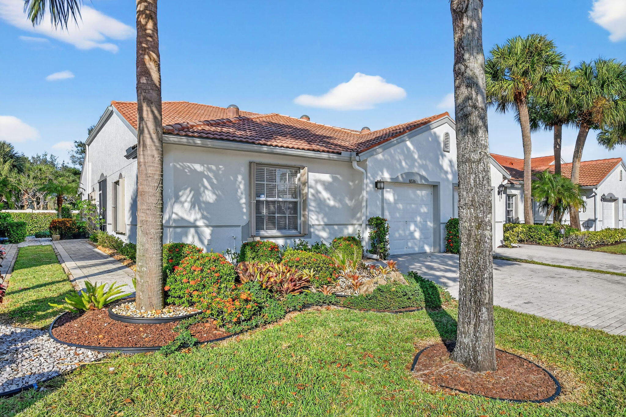 Lovely end-unit villa in highly sought-after Venetian Isles active adult community. Perfect for snowbirds or year-round South Florida living. Well-maintained home features a BRAND NEW ROOF  w/transferable warranty. Exterior freshly painted,tile flooring/neutral tones throughout, & natural light, skylight in Spacious kitchen W/ stainless steel appliances & new refrigerator.Great room w/built-in bar - ideal for entertaining.Primary suite w/walk-in closet,new fan,& bath w/walk-in shower.Enjoy peaceful days on the private screened patio. new smoke detectors. A/C is 4-years old & servicedyearly Enjoy resort-style amenities & diverse activities.clubhouse/upstairs bar,overlooking 2 pools,fitness center,tennis,pickleball & bocci ball.Located near shopping,dining,beaches & turnpike. Partial furnish Partial Furnished , TV with mount. This is a beautiful villa!  See it today ! Live the great South Florida lifestyle !!!!