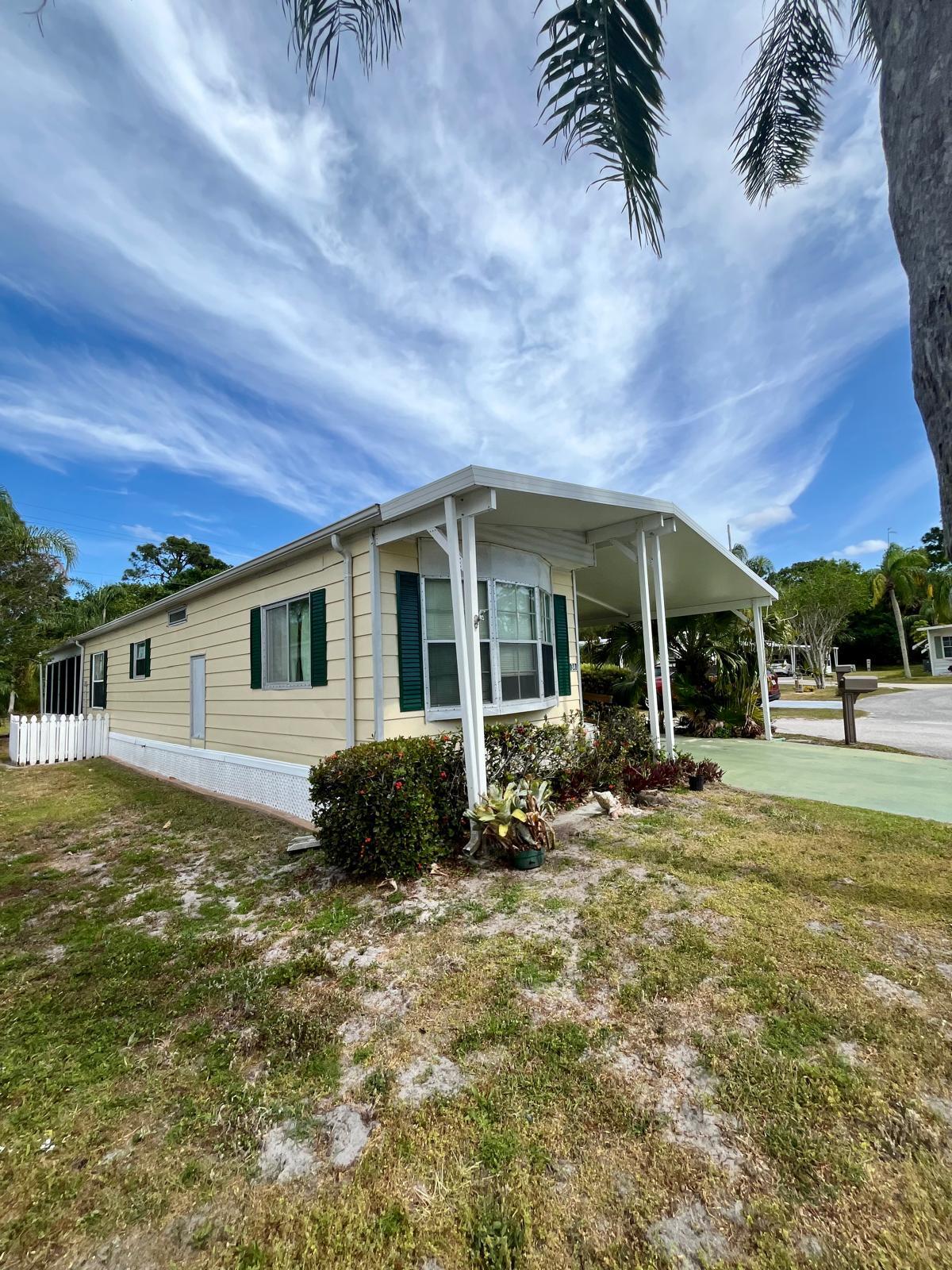 READY TO SELL. Welcome to this beautiful home move-in ready, in pet section, with two spacious bedrooms with ample closet space, with a big and comfortable living area perfect for relaxing, fully equipped kitchen for cooking and entertaining and an enclosed Florida room space ideal for enjoying the Florida sunshine. With its proximity to beaches, stores, and restaurants, this mobile home offers the perfect blend of relaxation, convenience, and lifestyle. Enjoy the best of Florida living in this beautiful 55+ community! - Clubhouse with social events and activities - free golf - Swimming pool and outdoor recreation areas - Walking trails and outdoor spaces for relaxation - tennis, billiards, fitness and more. The land rent includes trash removal and land care,