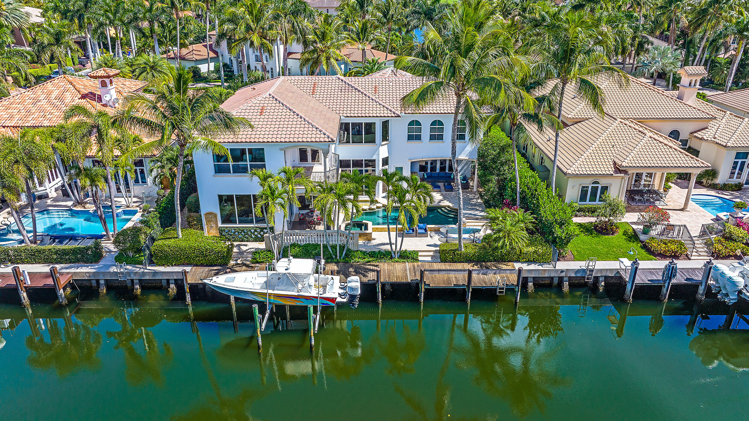 Welcome to Harbour Isles: A very private, gated, Waterfront community with deep water, ocean access, 24-hour manned guardhouse, and under 100 homes. 90' canal frontage can accommodate up to a 70ft yacht, or multiple boats with lift. This meticulously maintained, custom design built home has fantastic curb appeal with its large Chicago brick driveway and oversized 3-car garage. The backyard faces a lush preserve, offering serene views and privacy to relax with no homes across the canal. The back features a summer kitchen, Ipe Brazilian hardwood dock, custom landscape and pool lighting. The home has recently been painted inside and outside. (See supplemental...) Some interior highlights include newly updated Cristallo quartzite stone tops in the kitchen and a Vantage Home Automation system control for lights, thermostats, drapes and fountain. Upstairs is a large air-conditioned, fully equipped workout room. The Oversized Master suite with large sitting area opens to an expansive, private balcony with stunning views. Paradise found.