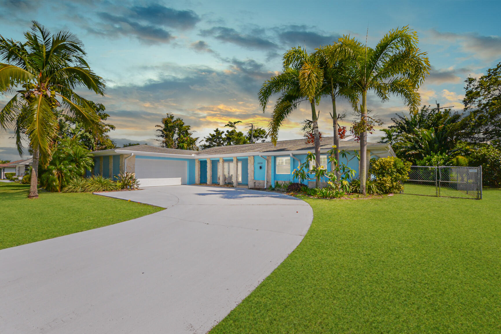 Located in the established community of Sandpiper Bay, this 4-bedroom, 2-bath pool home offers a flexible split floor plan and a layout that makes everyday living easy. From the moment you walk in, you're welcomed into the main living area, with double French doors opening out to a screened-in pool—creating a natural indoor-outdoor flow that's hard to find at this price point.  The kitchen features dark wood cabinetry and Corian countertops, opening into the main living space for a connected feel. The split-bedroom layout provides added privacy, with a fourth bedroom that works well as a home office, guest room, or flex space depending on your needs.  Out back, the screened pool area overlooks a fenced yard with mature palm and fruit trees, along with a shed for additional storage offering both privacy and usable outdoor space.  This home has been lived in and will benefit from updates, including paint and minor repairs, but presents a strong opportunity for a buyer looking to personalize a property in a well-established neighborhood. The garage has been partially enclosed to allow for additional storage.  Conveniently located near golf, parks, shopping, dining, and major roadways.