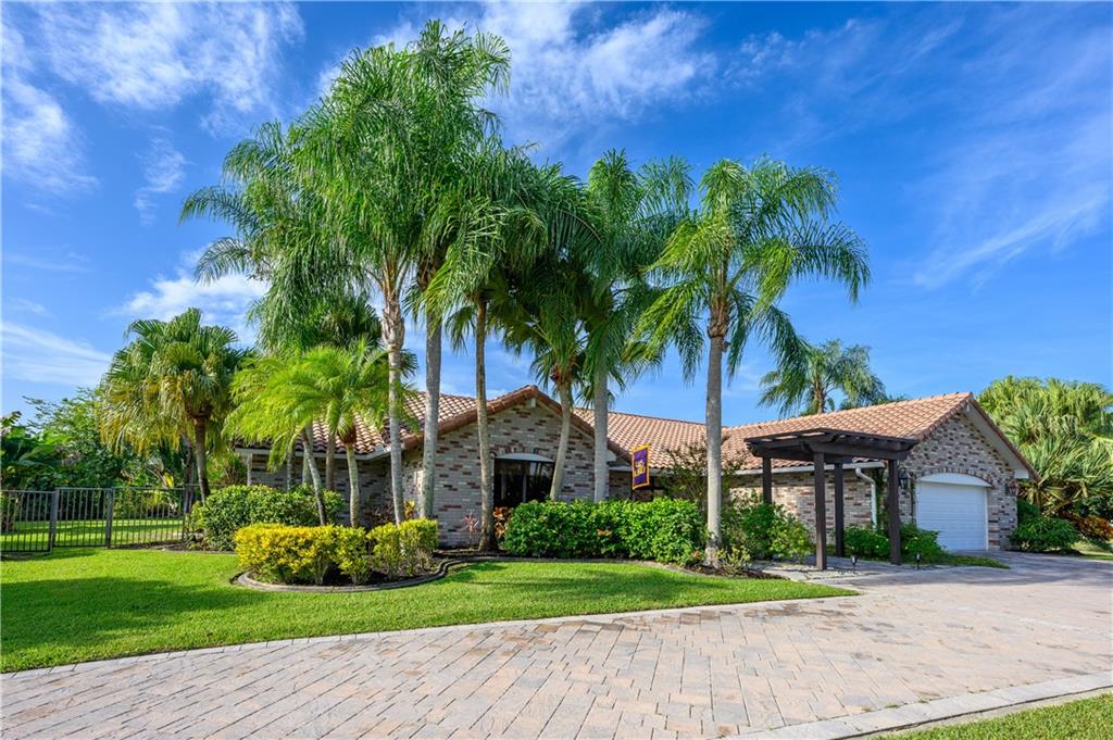 This is the house you've been waiting for!! Don't look anymore!!!Walk into this amazing ranch home style property with a spacious driveway. Beautiful 4 bedroom, 3 and 1/2 bath and 2 car garage. This home features elegant bamboo floors, SS appliances, granite countertops and lots of storage space for your comfort. Master bedroom is a dream come true!!spacious room, custom HIS and HER walking closets, exquisite remodeled master bathroom.Have dinner with a relaxing pool view, enjoy gardening and the peace of this home in just under 1 acre!! Impact windows throughout the house, AC is one year old, water heater just replaced!!Desirable WINDING LAKES neighborhood, great schools, shops and restaurants. YOU CAN'T MISS THIS OPPORTUNITY!!!OPEN HOUSE SATURDAY NOV 27th from 12-4