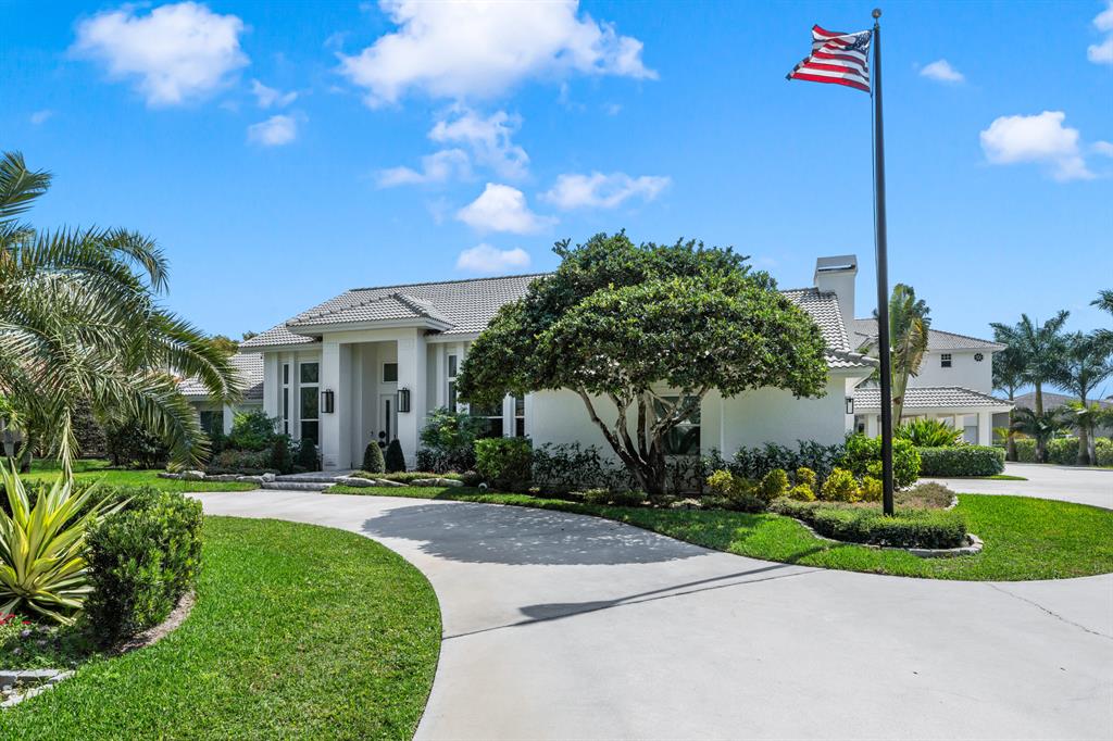 Fly in or drive to this newly renovated Aero Club Estate on just under an acre with 2,160 sf hangar. Aero Club is South Florida's premier aviation community minutes from Wellington's shopping, dining and equestrian facilities, and less than 15 miles from Palm Beach. Current owners have completed the transformation of the five bedroom, 3.5 bathroom main residence, and no detail has been overlooked. The home features timeless finishes including solid wood floors throughout, 14' ceilings, quartz countertops on a 5 x 17 foot long conversation island with 5 foot double commercial sink with dual faucets and Thermador appliances in chef's grade kitchen. The primary bedroom features a spa-like primary bathroom with an oversized tile shower, separate water closet, two custom closets... and custom lighting. The residence also features a  1,000 bottle, temperature controlled wine cellar off the grand entry. The screened in newly resurfaced pool and paver patio features a built in summer kitchen and overlooks the beautifully landscaped backyard. The residence features energy efficient lighting, 57 solar panels and backup propane generator. The main residence is connected to the hangar and 2000 sf guest apartment via a covered breezeway offering opportunity for multi generational families, live-in nanny or seasonal rental. The apartment features one bedroom with full attached bathroom, a newly renovated home movie theater, and huge game room with a full kitchen and half bath. The hanger features a 50' opening to the grass taxiway and 4,000' paved runway. The estate provides ample room for full time resident or offers a turn key, low maintenance opportunity for part time resident with room to store RV, plane, automobile collection or business equipment. Many behind the scenes improvements including: New impact windows and doors. New A/C units, plus a chiller for the wine cellar, all equipped with HALO LED UV lights, all new A/C duct work, Aroma 360 home scenting system. Custom drapery in main house. Landscape lighting, new sprinkler pump. Electric washer and gas dryer in main house, additional electric washer and dryer in hanger. Icynene insulation, safe room in the primary closet, new electrical wiring throughout, new owner-owned 500 gallon propane tank, new gas fireplace, 2 gas tankless water heaters, new copper plumbing, whole house automation (lights, A/C, alarm, garage door, locks, yard lighting), Ring alarm system, Network wired and server room, Covered walkway and pool deck wired and for music with recessed speakers. Rain Soft water system, 57 solar panels (entire FPL bill is $30 a month), new pool pump and filter system with salt system. New pool cleaner. Custom closets in secondary rooms and so much more...A fact sheet on all improvements available upon request. Furnishings negotiable for completely turn key option. 

RECENT IMPROVEMENTS:

" All new a/c units in the house (3), plus a chiller for the wine cellar, a new split unit for the storage closet in the hanger.
" All main a/c units have new HALO LED UV lights in including hanger apartment.
" All A/C duct work and vents in the main house are entirely new. 
" All attics have Icynene insulation installed.
" Safe room built into the primary closet.
" Main house has all new electrical wiring.
" Main house has a new fireplace insert and is propane operated.
" New 500-gallon propane tank, owner owned, not leased.
" Main house has (2) tankless hot water heaters and is propane operated.
" The main house has all new water lines from the serviced through the attic.
" Primary bathroom has Rohl fixtures.
" New temperature-controlled wine cellar that holds approx. 1,000 bottles.
" All new flooring installed in the main house.
" Whole house automated - lights, a/c thermostats, alarm, garage door, locks and yard lighting.
" Ring alarm system.
" Network wired and server room.
" TVs included.
" New double insulated garage door and opener.
" All walls in the main house have 5/8' inch drywall.
" New kitchen appliances in main house are all Thermador.
" Whole home Rain Soft water system.
" Whole home generator.
" 57 solar panels on the roof of the hanger, electric bill with an average of $30 dollars a month for the entire property!
" Hangar, covered walkway, and pool deck are wired for music.
" Entire house and hanger have impact windows and doors.
" New sprinkler pump.
" New pool pump and filter system with salt system.
" New pool cleaner.
" 5' x 17' kitchen island with quart countertop.
" Custom closet systems.
" Entire house is LED lighting.
" Main house - 5 bedrooms, 3 bathrooms, 1 half bath.
" Apartment - 1 bedroom, 1 bathroom, 1 half bath, full kitchen and home movie theater.
" Aroma 360 home scenting system.
" Custom drapery in main house.
" Landscape lighting.
" Electric washer and gas dryer in main house, electric washer and dryer in hangar.
