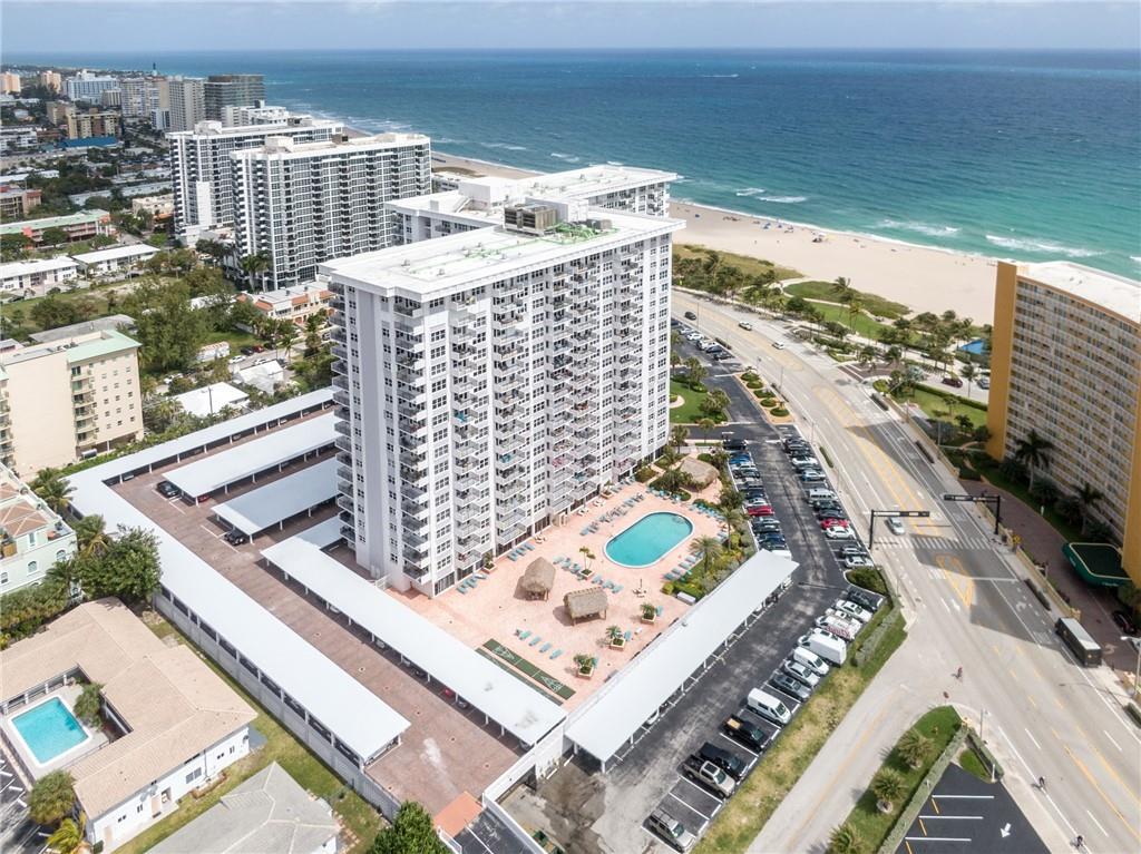 Location is key at this gorgeous renovated studio directly across from the Pompano Beach.  Enjoy living steps from the sand in this awesome unit!  The condo features impact windows, updated kitchen with new cabinets, granite counters, tile floors throughout, stainless appliances and breakfast bar.  The bathroom is also updated with walk in shower and new vanity.  The unit also has impact windows and doors, built in closets for extra storage, hot water heater, new AC & more! Building amenities include; heated pool, sauna, fitness room, BBQ grills, card room, Library, meeting room, door man, security & more!  Enjoy your very own beach unit! This great unit is perfectly located just 2 blocks north of the pier and all the new amazing restaurants, shopping & more!