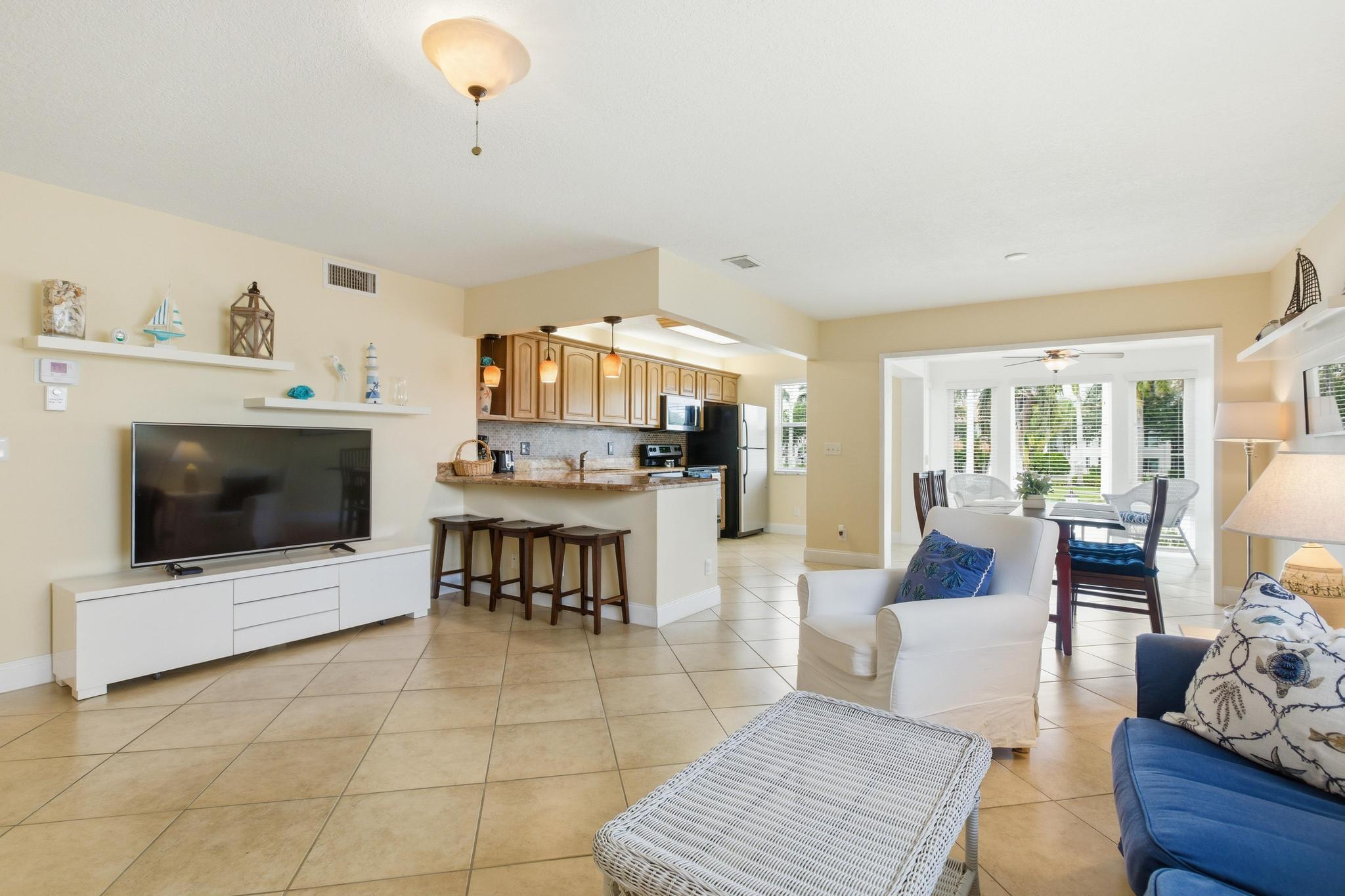Welcome to Colonial Club, one of Boynton Beach's most desirable Intracoastal communities. This beautifully updated 1-bedroom, 1.5-bath corner residence offers a spacious and open floor plan with tasteful upgrades throughout. The custom kitchen features granite countertops, stainless steel appliances, decorative backsplash, and abundant cabinetry, flowing seamlessly into the living and dining areas. Additional interior improvements include tile flooring throughout, knockdown ceilings, updated bathrooms, modern fixtures, and upgraded electrical. Enjoy peace of mind with numerous recent upgrades, including hurricane-impact windows, updated electrical systems, a brand-new air conditioning system installed in 2026 with a 10-year warranty and 2-year maintenance plan, a new roof, and all current assessments paid in full. Ventless washer/dryer systems are permitted, offering added convenience. Colonial Club residents enjoy resort-style amenities including a heated saltwater pool overlooking the Intracoastal Waterway, a 1,500-foot waterfront promenade, clubhouse, fitness center, billiards room, card rooms, banquet facilities, BBQ area, and beautifully maintained tropical grounds. Condominium fees include exterior maintenance, building insurance, water, Bluestream Fiber cable television, and high-speed internet. The building has completed required structural recertification and maintains strong reserves in compliance with Florida condominium requirements. Ideally located just minutes from beaches, waterfront dining, shopping, and the renowned restaurants and entertainment of downtown Delray Beach's Atlantic Avenue. Convenient access to Palm Beach International Airport, I-95, and major area attractions makes this an exceptional opportunity to enjoy the South Florida lifestyle.