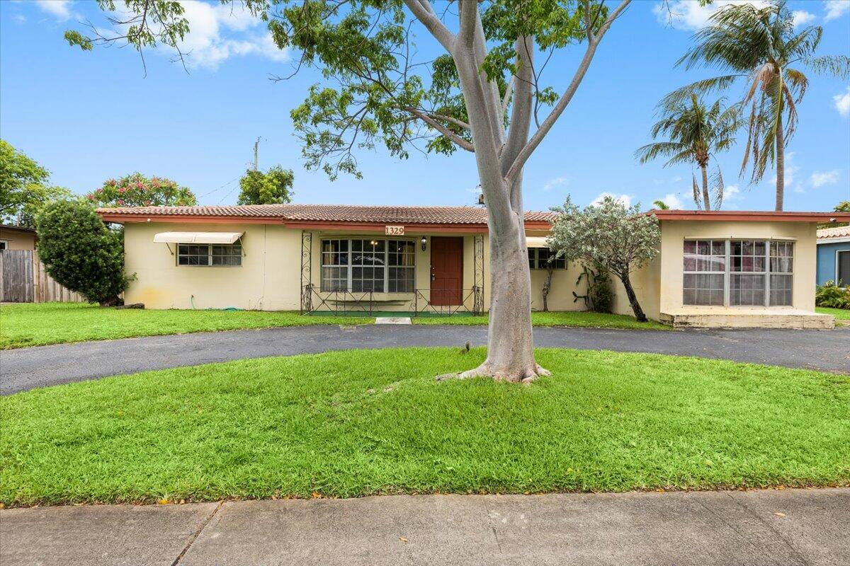 Welcome to Lyons Park! This charming home features a desirable split floor plan with the primary suite on one side and two additional bedrooms on the other, offering comfort and privacy. A standout feature is the oversized family room—perfect for relaxing or entertaining.  A flexible room that was a garage conversion and has a separate entrance can easily serve as a 4th bedroom, guest suite, home office, or private space for extended family. The home maintains its original character, giving you the opportunity to update and customize to your style.  A brand-new HVAC system is already in place, providing added peace of mind. Conveniently located near shopping, dining, and major roadways, this property is ideal for buyers looking to settle in and make it their own.