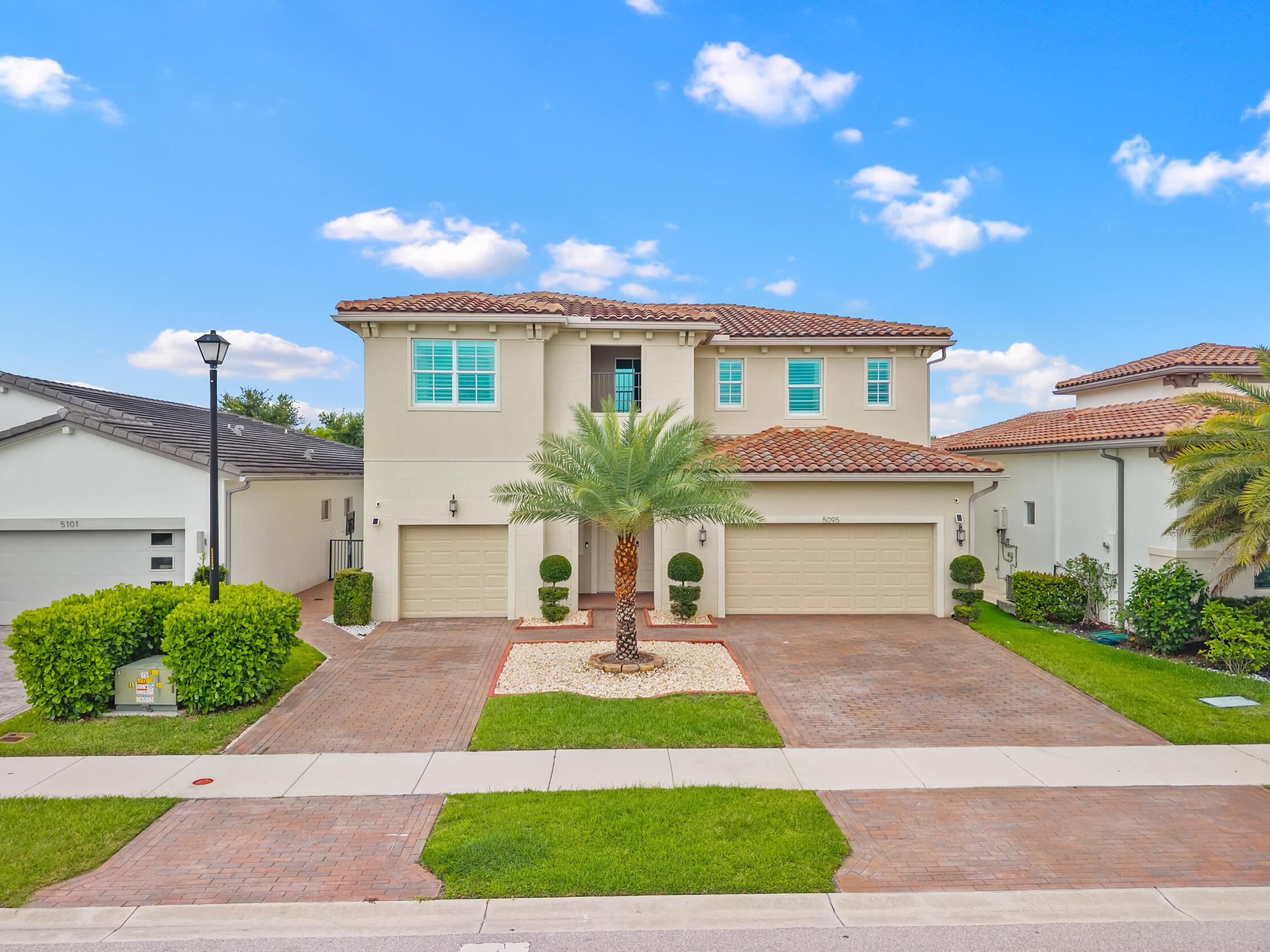 Welcome to Andalucia, one of West Lake Worth's premier gated communities. This exceptional 5-bedroom, 5.5-bathroom home offers 3,700 square feet of thoughtfully designed living space. The chef's kitchen is the heart of the home, featuring a large center island, GE Café appliance package, walk-in pantry, and abundant storage. The spacious first-floor primary suite provides a private retreat, while upstairs you'll find three secondary bedrooms, each with its own en-suite bath, plus a large loft ideal for a media room, home office, or play area. Additional highlights include a generous laundry room with LG Tower washer and dryer. Step outside to your private backyard oasis featuring a saltwater pool, spa, and sun shelf!