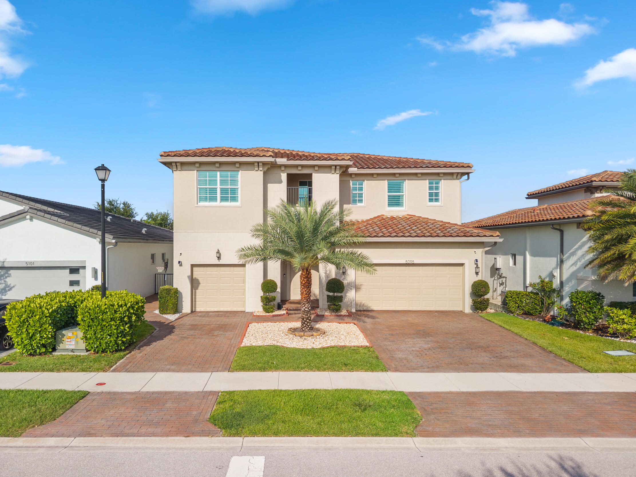 Welcome to Andalucia, one of West Lake Worth's premier gated communities. This exceptional 5-bedroom, 5.5-bathroom home offers 3,700 square feet of thoughtfully designed living space. The chef's kitchen is the heart of the home, featuring a large center island, GE Café appliance package, walk-in pantry, and abundant storage. The spacious first-floor primary suite provides a private retreat, while upstairs you'll find three secondary bedrooms, each with its own en-suite bath, plus a large loft ideal for a media room, home office, or play area. Additional highlights include a generous laundry room with LG Tower washer and dryer. Step outside to your private backyard oasis featuring a saltwater pool, spa, and sun shelf!