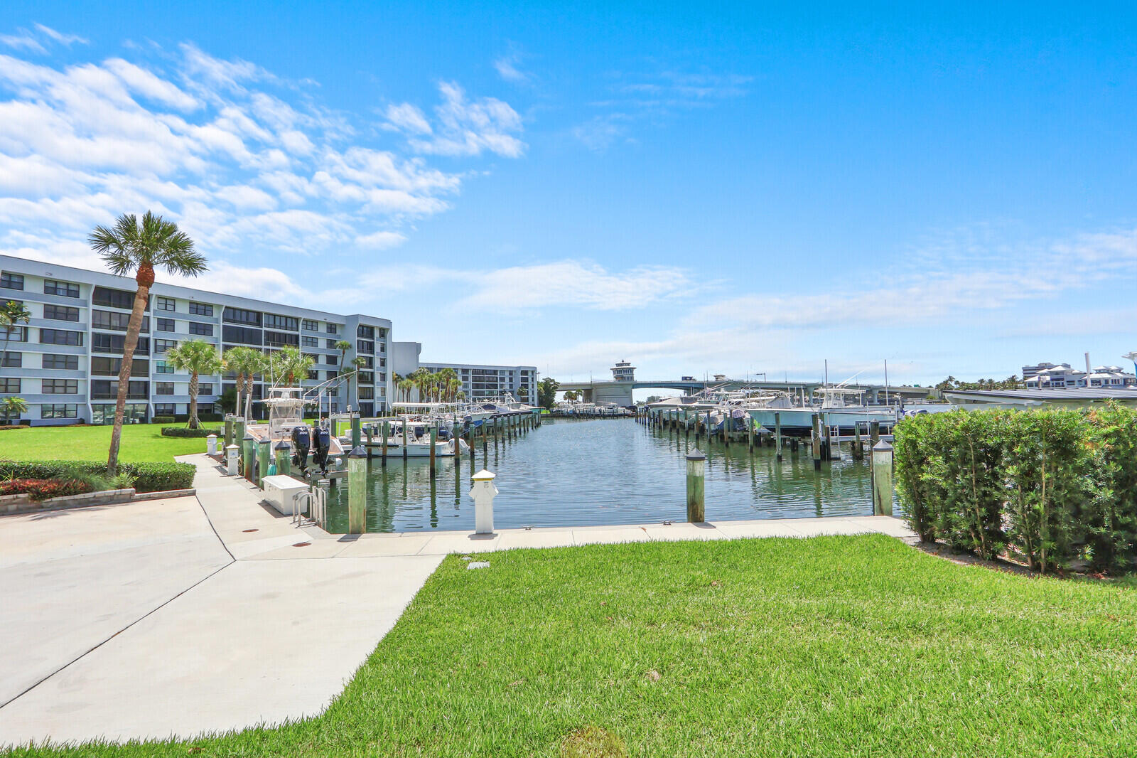 Experience Jupiter's ultimate coastal lifestyle in this beautiful 2-bedroom, 2-bathroom condo, located within the highly desirable, gated, direct-Intracoastal community of Jupiter Cove. Perfect for boating enthusiasts, this sought-after waterfront enclave offers quick access to the Jupiter Inlet and ocean, where vibrant blue waters flow in with each tide, creating breathtaking views right outside your windows. Boat slips are available for sale or lease when offered. Enjoy a range of resort-style amenities, including a lively waterfront tiki bar with grilling stations, paddleboard and kayak storage, pickleball and tennis courts, a heated pool, a fitness room, and a party room. An on-site manager adds to the convenience of community living. Inside, you'll appreciate spectacular, panoramic sunset and gorgeous azure water views with desirable southern exposure. The open-concept kitchen seamlessly connects to an expanded living space, as the patio has been incorporated into the interior for maximum enjoyment of the waterfront setting. Perfectly situated on the scenic Intracoastal Waterway, this condo offers an exceptional opportunity to embrace the best of Jupiter's coastal living.