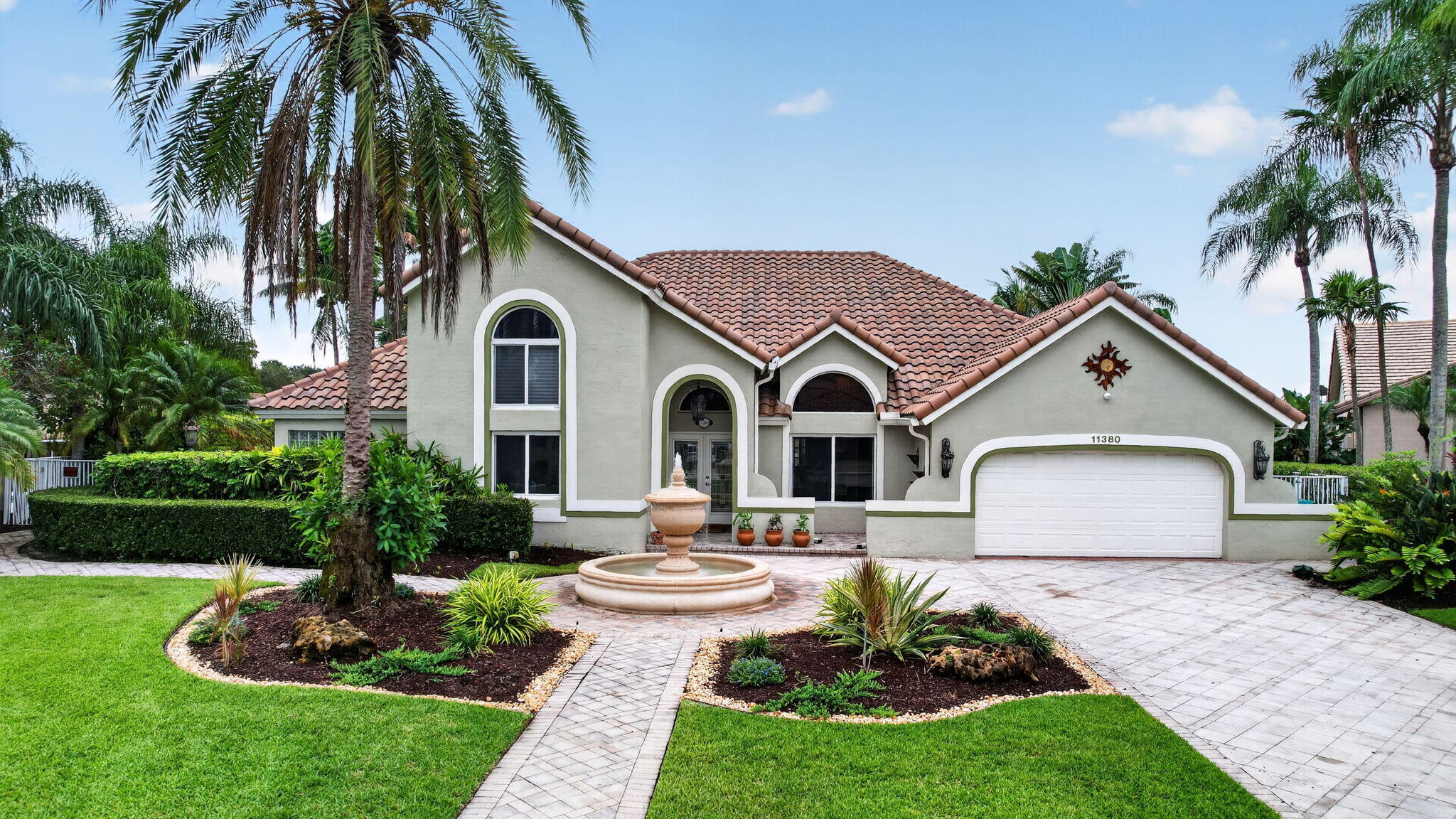 Rare opportunity to own this spacious 6-bedroom, 5-bath, 3885 sq. foot waterfront residence on a quiet cul-de-sac in highly desirable Cooper City, known for its top-rated schools. Enjoy breathtaking sunrises and sunsets from your private backyard oasis. This meticulously maintained home features a new tile roof (2024), Tesla solar system with Powerwall battery backup, impact windows, whole-house water filtration, and newer A/C systems. The open floor plan offers soaring vaulted ceilings, a large chef's kitchen, and an oversized family room designed for everyday living and entertaining. Step outside to a covered lanai with outdoor cooking area, resort-style pool, expansive paver deck, and multiple gathering spaces perfect for hosting family and friends. A rare combination of size, location, waterfront living, energy efficiency, and lifestyle amenities in one of Cooper City's most sought-after neighborhoods.