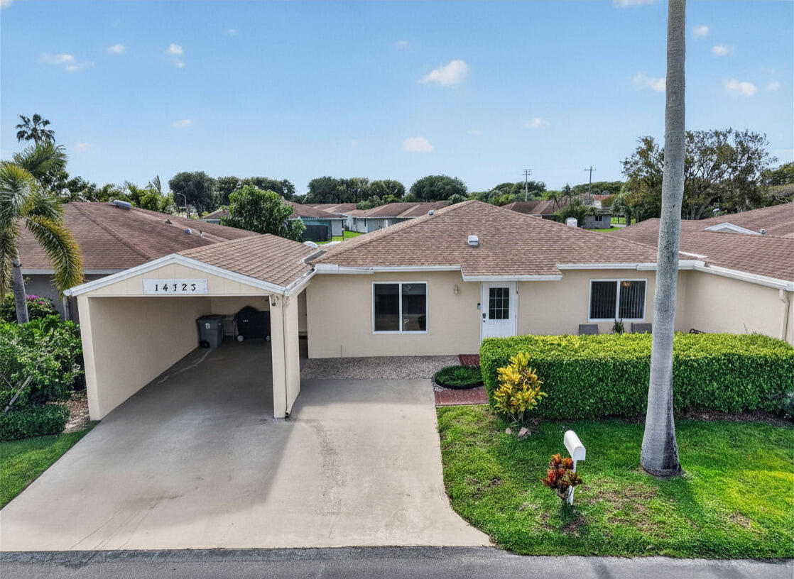Welcome to this spacious and beautifully maintained turnkey 2BR/2BA villa in Camelot Village, offering the largest floor plan in the community with 1,485 sq ft of living space. This light and bright home features a generous living and dining area, a separate family room, and a versatile Florida room—perfect for a 3rd bedroom, home office, or additional living space and extra storage. Skylights fill the home with natural light. Enjoy peace of mind with a new roof, hurricane-impact windows, and hardwired floodlights with security cameras, ideal for South Florida living. Conveniently located just a short walk to the clubhouse, enjoy the amenities including a clubhouse, pools, fitness center, game rooms, and theater. With one of the lowest HOA fees in Delray Beach.  It has everything you need.