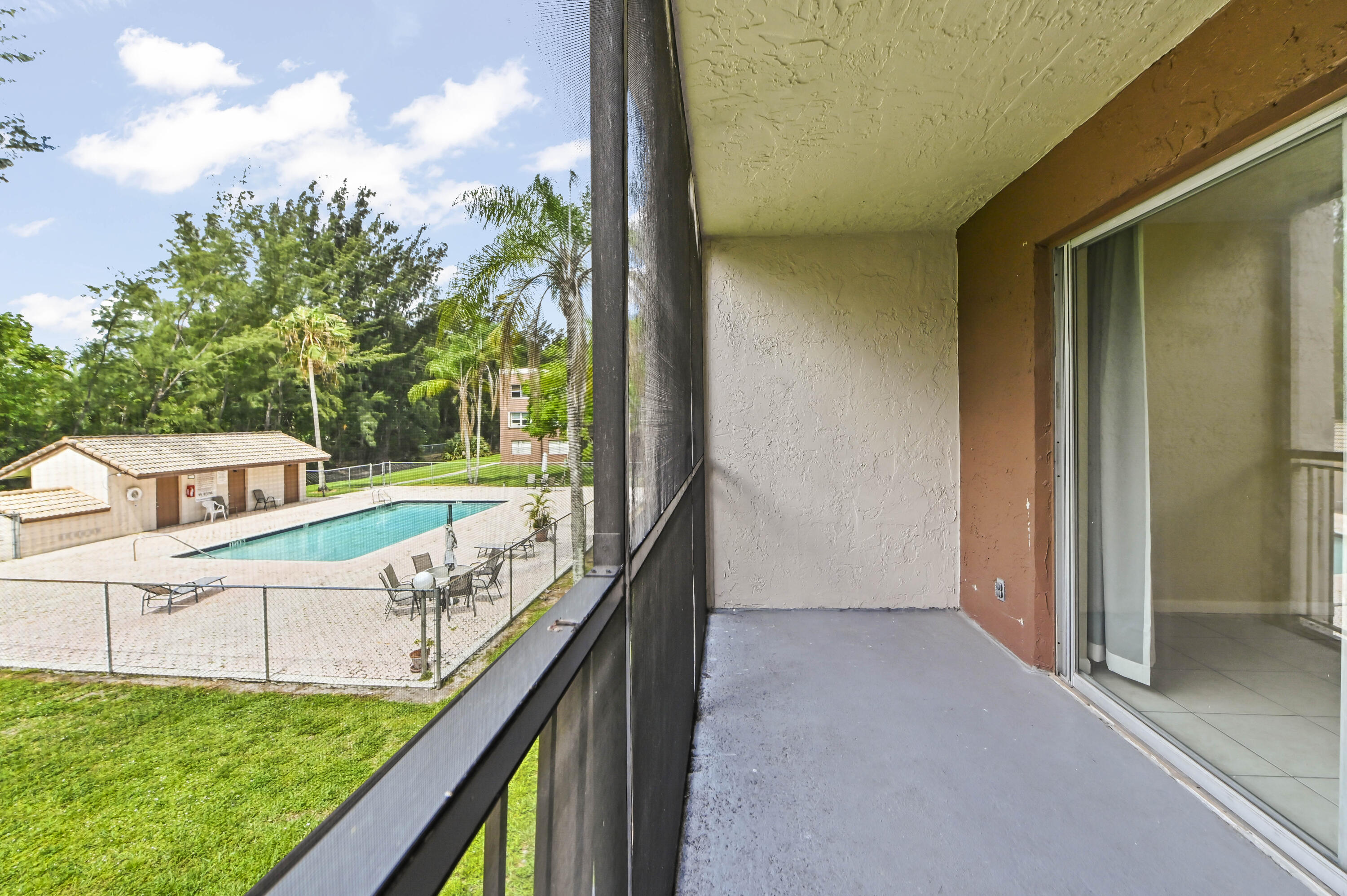 Motivated seller, son graduated and relocated.  Largest 3-bedroom, 2-bath condo in Nova Gardens offering 1,550 sq ft.  Conveniently located near Nova Southeastern University and Florida Atlantic University. This second-floor unit features a large primary bedroom with space for a sitting area plus two closets, including a walk-in, tile and vinyl flooring throughout, newer appliances, and a screened balcony overlooking the pool.  The main bathroom has been updated, the water heater was replaced in 2024, and the breaker panel and main breaker have been upgraded. Laundry is conveniently located just outside the unit. The community offers 2 pools, buildings are being painted, there are no special assessments, and the maintenance fee includes water, sewer, and cable.