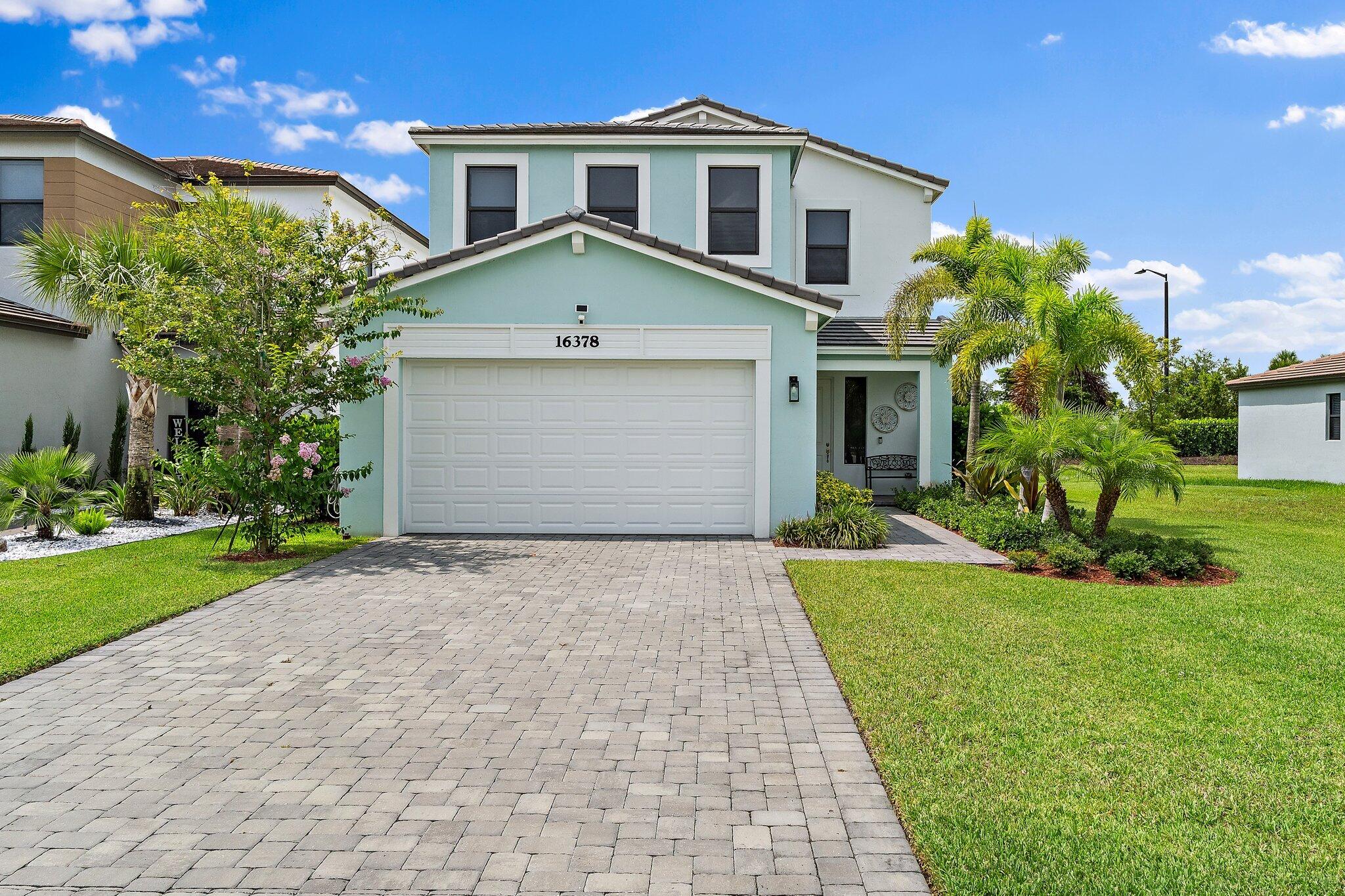 A beautifully appointed two-story residence in the sought-after community of Westlake. Designed for both comfortable living and effortless entertaining, this spacious home features 4 bedrooms, 3.5 bathrooms, a versatile loft, and a highly desirable first-floor bedroom and full bath—perfect for guests, multigenerational living, or a private home office.  The open-concept floor plan is complemented by abundant natural light, impact-resistant windows and doors throughout, and custom motorized shades that add both convenience and style. The chef-inspired kitchen flows seamlessly into the main living and dining areas, creating the ideal setting for everyday living and gatherings alike.  Upstairs, the generous loft provides flexible space for a media room, playroom, office, or additional lounge