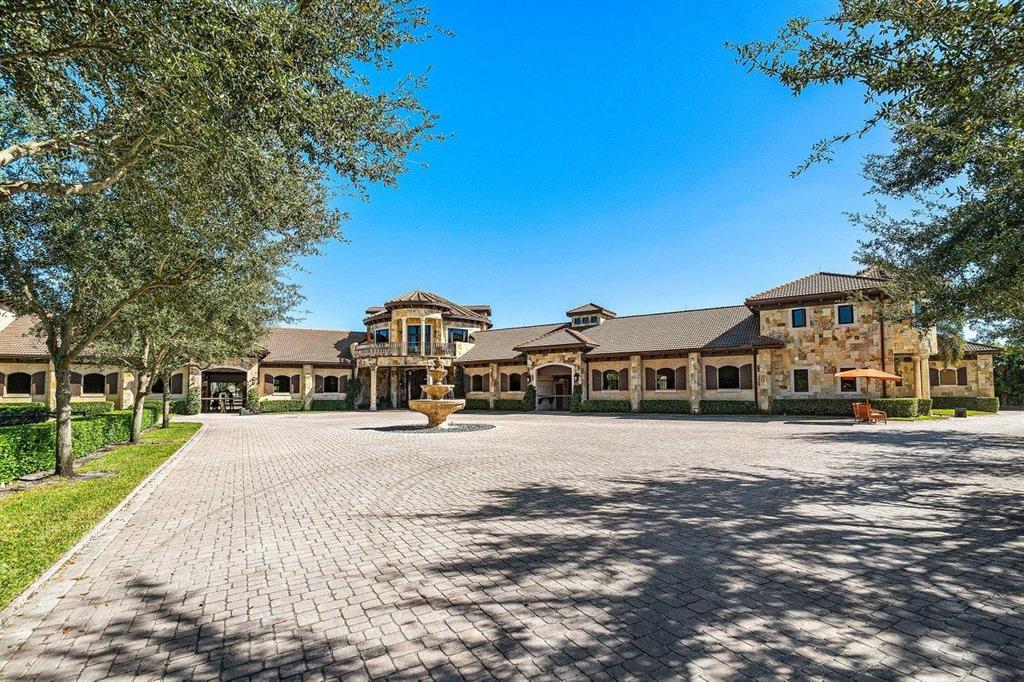 Completed in 2006, this 22-stall barn has timeless finishes throughout. 11 stalls on each aisle complete with fans, fly spray, and water. Camera system throughout. Chicago brick driveways and aisle-ways in the barn lead to a custom laid stone rotunda. Elegant second floor owner's lounge with full bath, along with a separate oversized one-bedroom apartment, and a two-bedroom staff apartment all have panoramic views of this well-maintained property. Additional studio apartment within the barn as well. 
Two tack rooms, four wash and grooming stalls, two laundry rooms, and multiple storage rooms provide the perfect working environment for a busy equestrian lifestyle. The exterior facilities include: Four paddocks, walker, a jump arena with new footing, and a grass jump field.