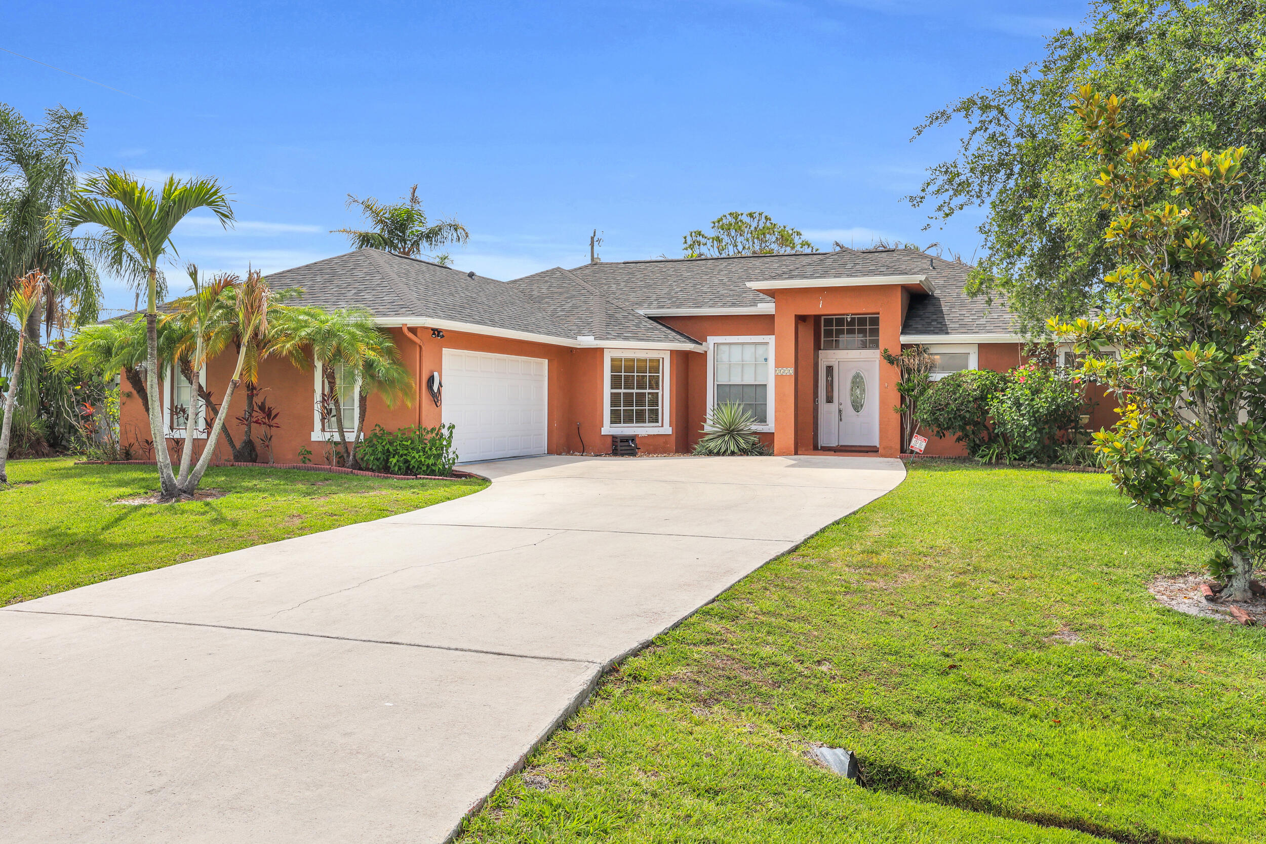 Situated on an oversized lot, this beautifully updated 3-bedroom, 2-bath, 2 car garage CBS home offers comfort, style, and modern efficiency. Inside, you'll find tile throughout, an open concept floor-plan and an large kitchen with a cozy breakfast nook, perfect for everyday living and entertaining. The spacious primary suite features a relaxing soaking tub and separate walk-in shower. Step outside to enjoy the white privacy fence surrounding the backyard, creating the perfect outdoor retreat. Additional highlights & upgrades include a Tesla charger in the garage, 25 yr warranty solar panels, water filtration system at the kitchen sink, 2022 A/C, and a Brand new Roof installed in late 2025. Home is close to shopping, beach, restaurants, medical, & more.