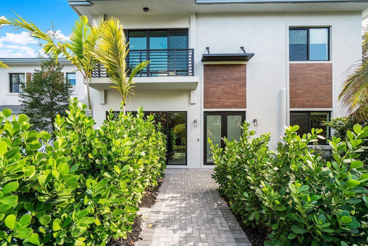 Gorgeous, modern, decorator finished and fully furnished 4 bedroom and 3 full bath townhome. Downstairs bedroom is used as an office Just east of Federal Hwy nestled in the beautiful waterfront community of Tropic Isle in East Delray Beach. Minute Walk to Delray Place shopping center with Trader Joes, shops and restaurants!