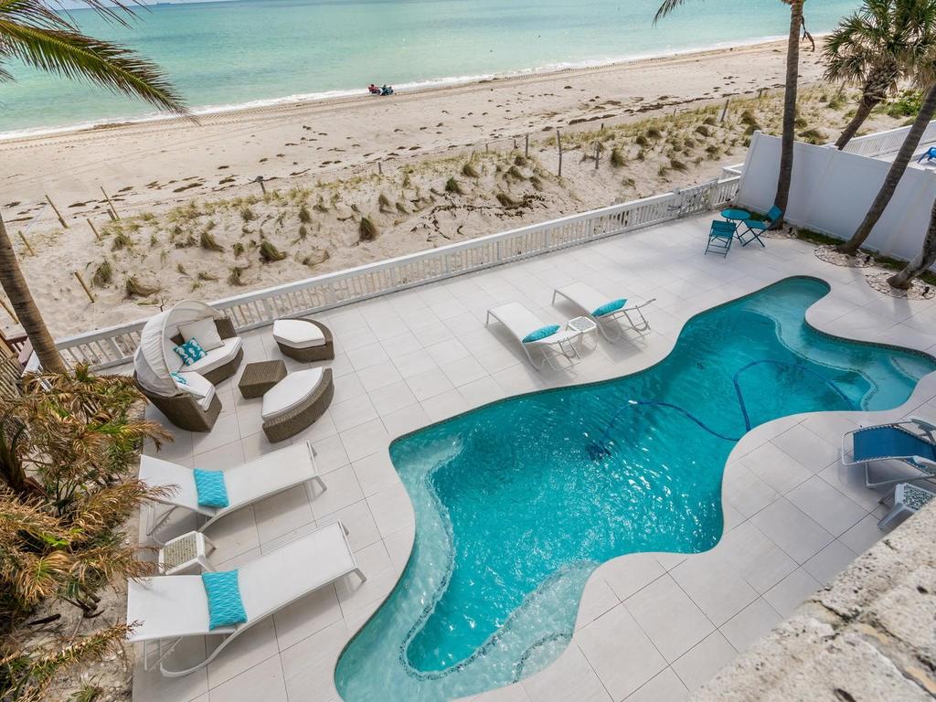 One of only 49 homes located directly on the sand on Fort Lauderdale Beach. This oceanfront pool home has been completely renovated. Full house generator with underground gas line and electric shutters will give you piece of mind for when the power goes out. New seawall with steel piling reinforcement. Private master suite with walk-in closet and private balcony with a stunning view of the ocean. Open floor plan with great summer kitchen and vaulted ceilings. Furniture negotiable.