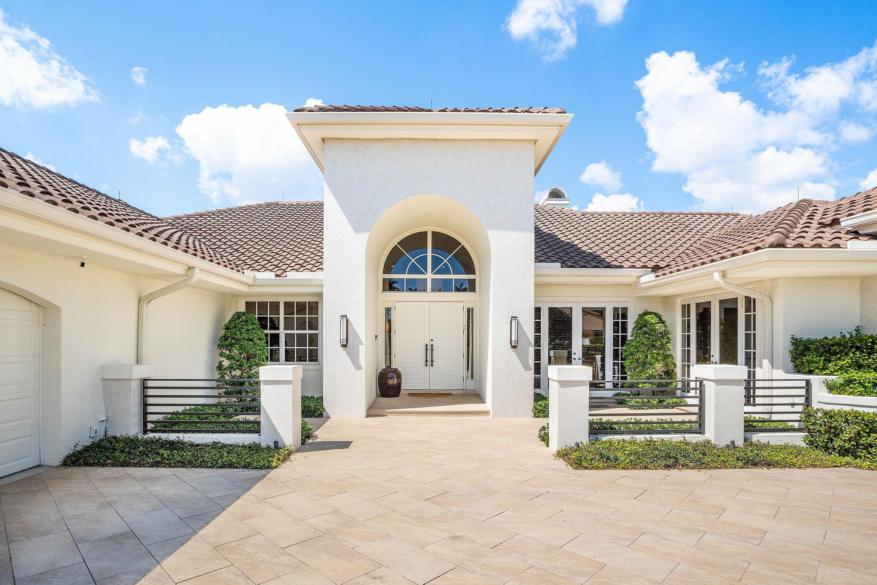 Perfection in St Andrew's Country Club- comprising 5471 sq ft, this 5 bedroom + office + den property on an OVERSIZED LOT has it all. Conceived as a home ideal for entertaining, the layout features multiple living and dining areas and a kitchen open to the family and breakfast rooms. These rooms offer easy access outdoors to an exceptionally large loggia, with spacious living and dining areas with custom cabinetry, and a fully out-fitted summer kitchen. The loggia features retractable screens and hurricane protection.  The home is ultra-functional and well designed, including a primary suite closet that is enormous. Functionality and expert design continue in the two custom outfitted offices, a den with custom cabinetry and ceiling detail, spacious bedrooms/baths, and an abundance of storage.  This warm and inviting home is located on .55 acres on the Palmer golf course, with two driveways, a motor court, and 3 + golf cart garages- features rarely found in SACC. It is also within walking distance to the Clubhouse.   A must-see!